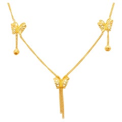 Collana unica di farfalle in oro giallo 24k