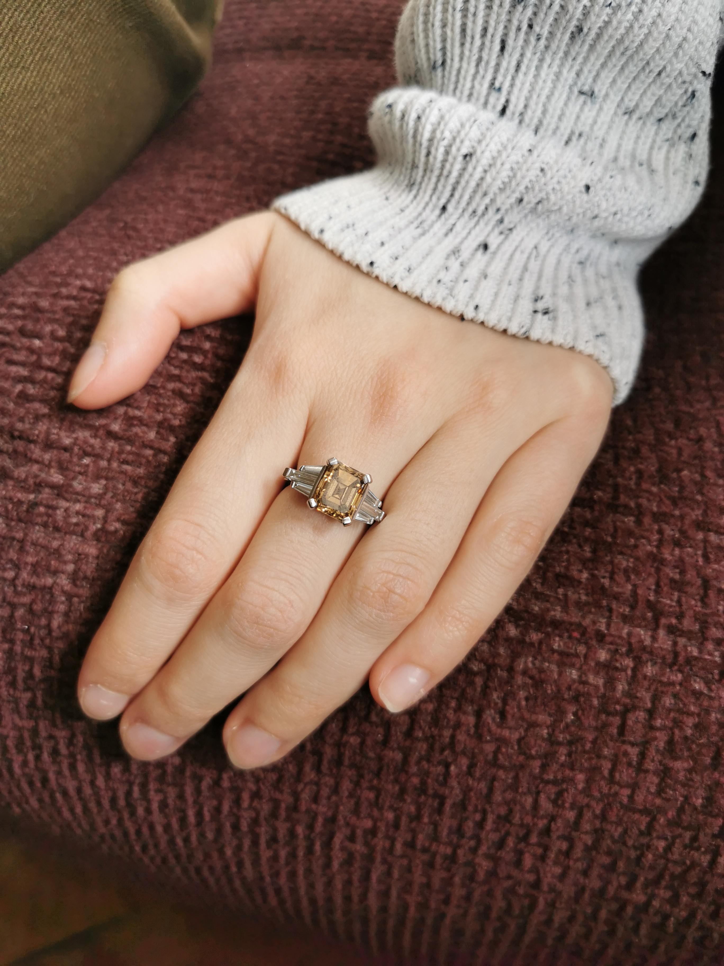 A magnificent 4.32 carats emerald cut natural chocolate diamond, set with six white baguette cut diamonds.
18K White Gold ring. 
This beautiful ring is a size 5 1/2 but can be  sized.
Created by Marion Jeantet
Natural chocolate diamond weight: