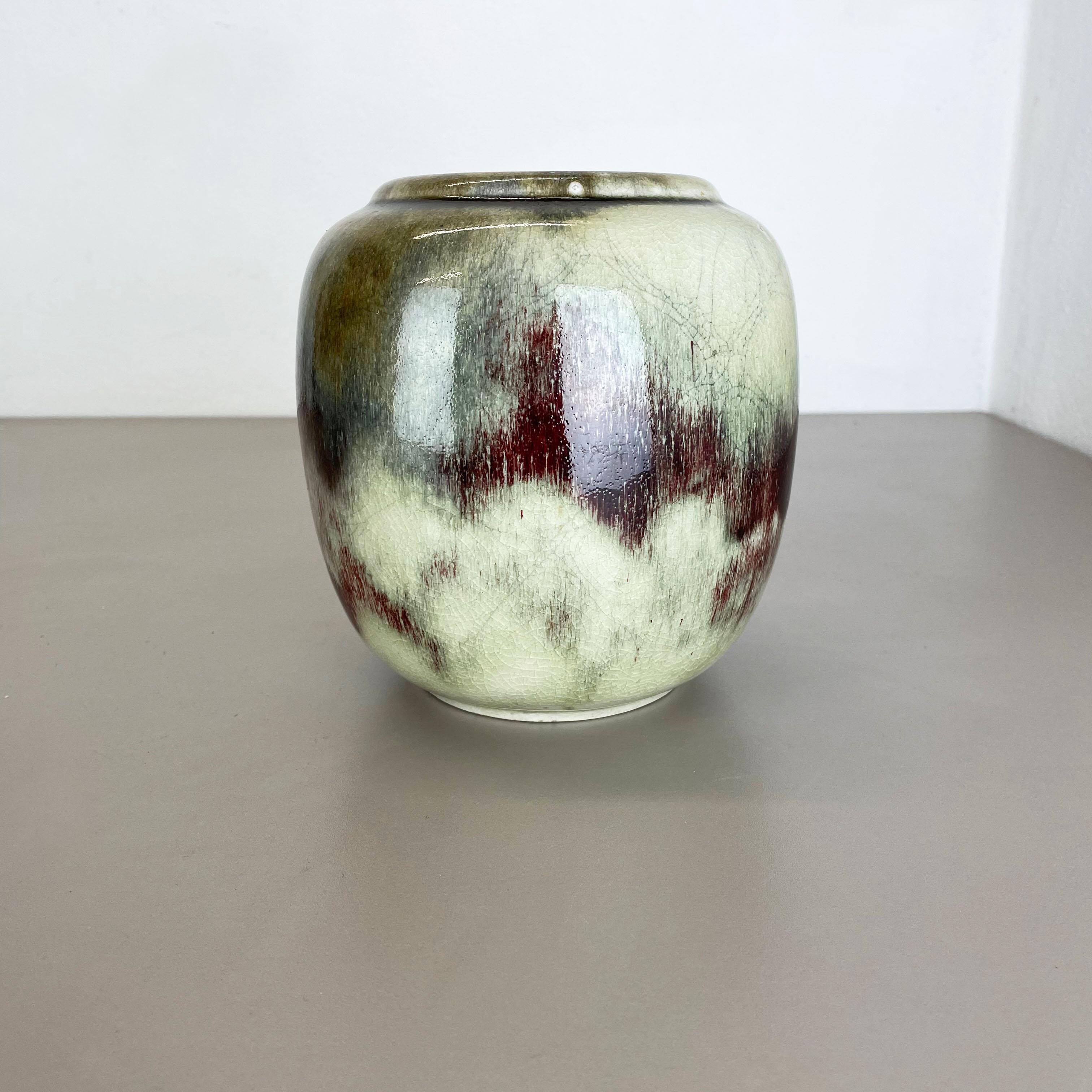 Article: ceramic vase object



Producer: WMF, Germany 



Age: 1930s



Description: 

Wonderful heavy Art Deco vase element designed and produced by WMF, Germany in the 1930s. This glass bowl is part the WMF Ikora collection made of