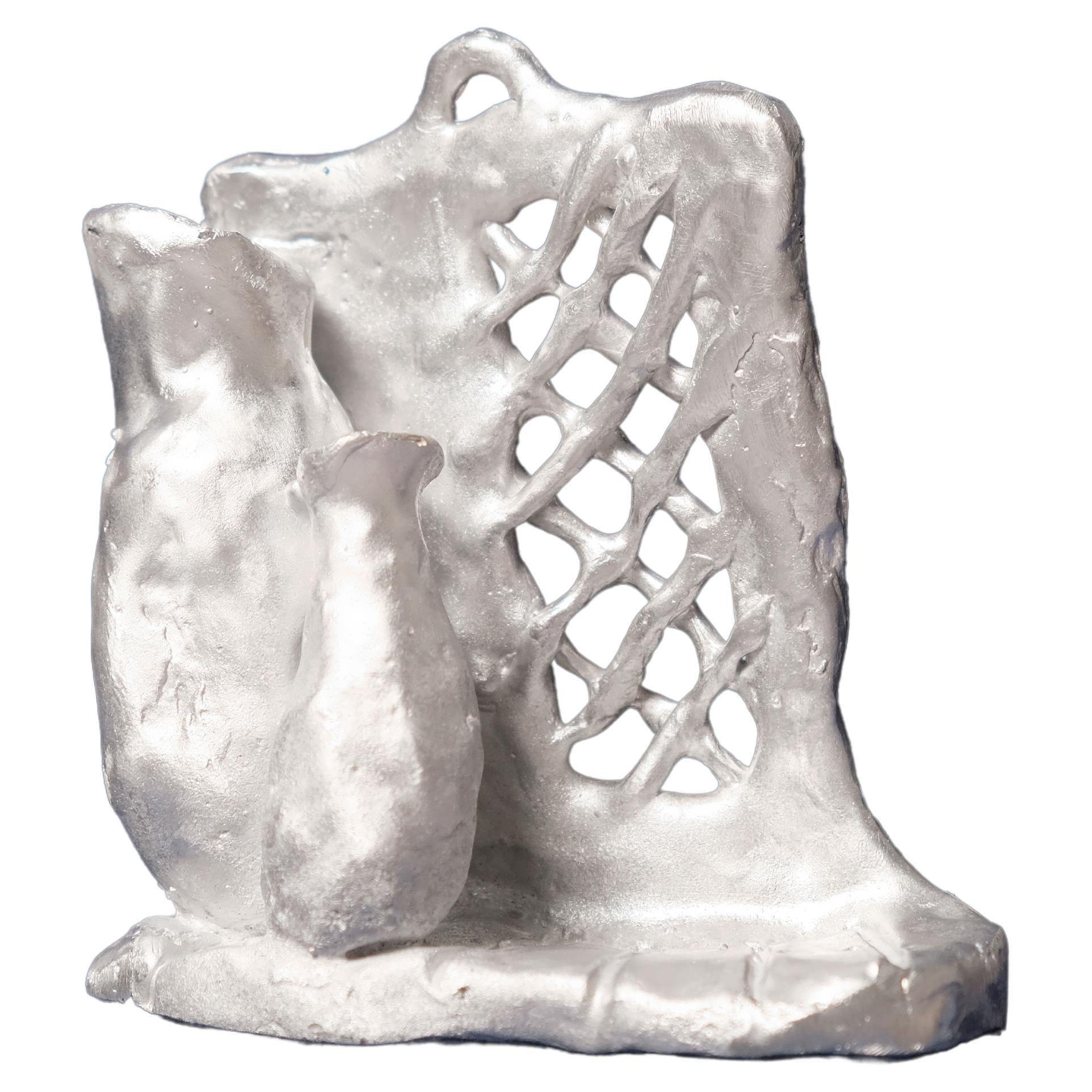 Handmade Aluminium cast wall sculpture depicting "Instant Wall"  For Sale
