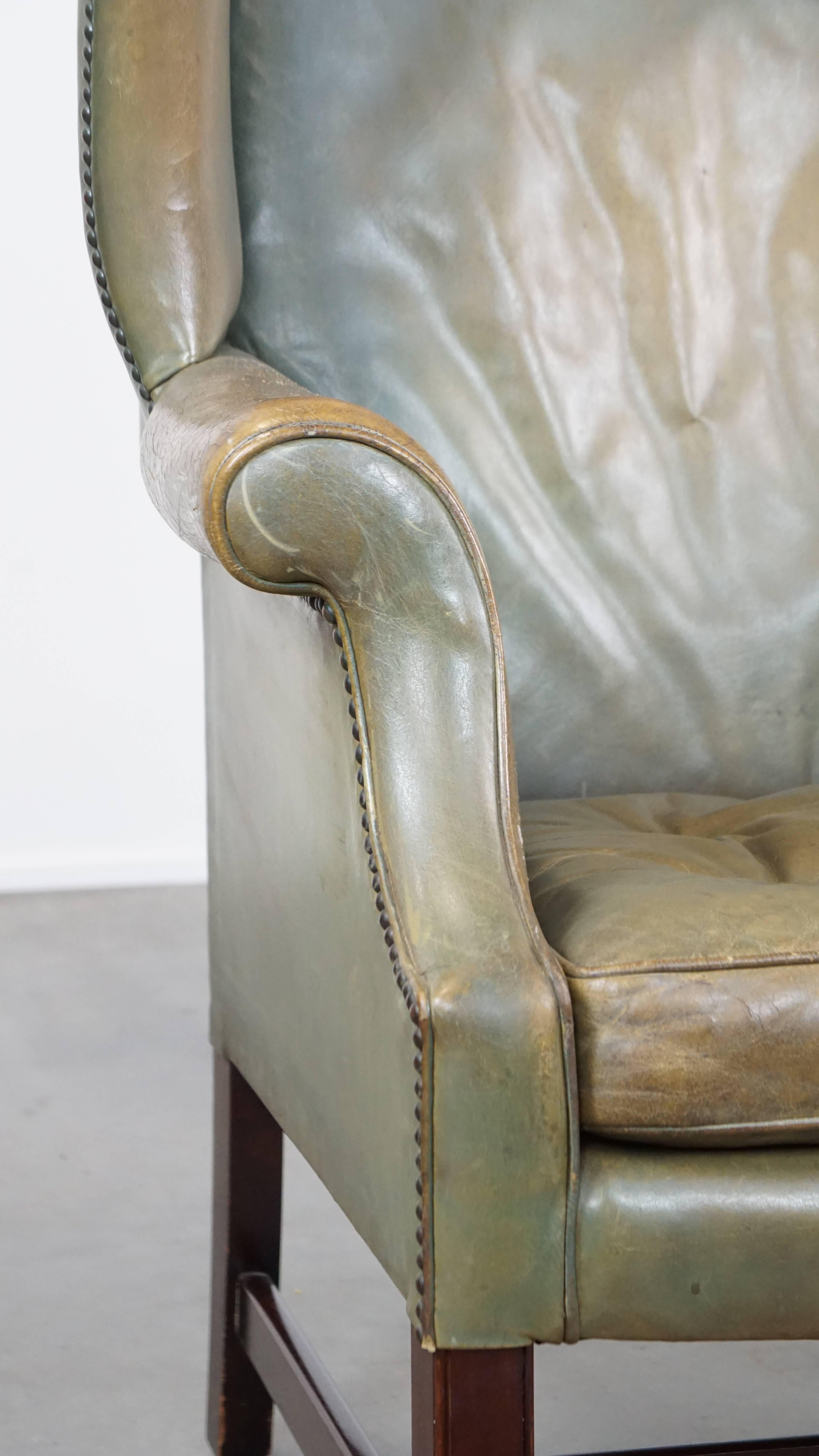 Unique and characterful green cowhide leather armchair with a beautiful patina For Sale 6