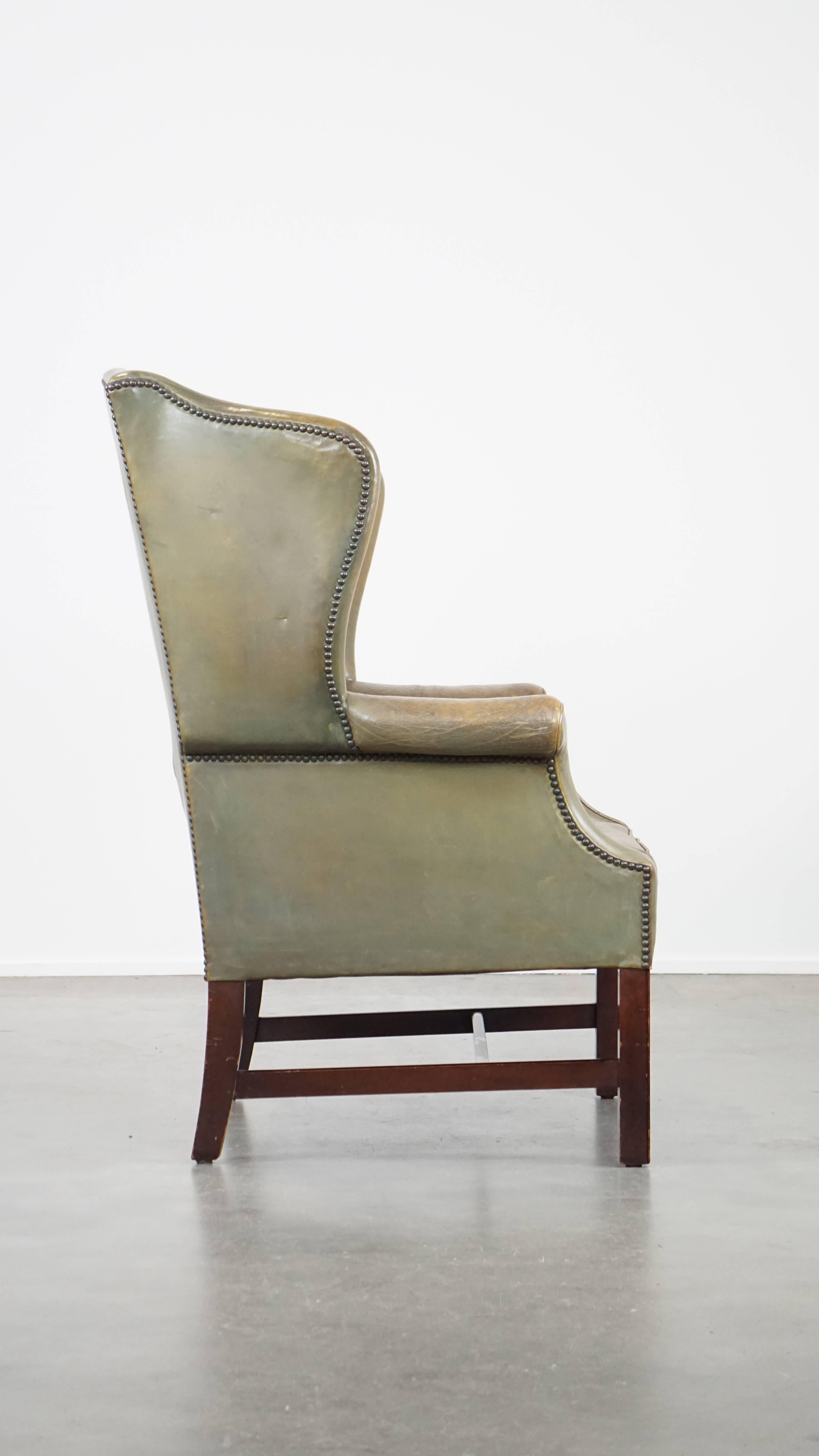 Hand-Crafted Unique and characterful green cowhide leather armchair with a beautiful patina For Sale