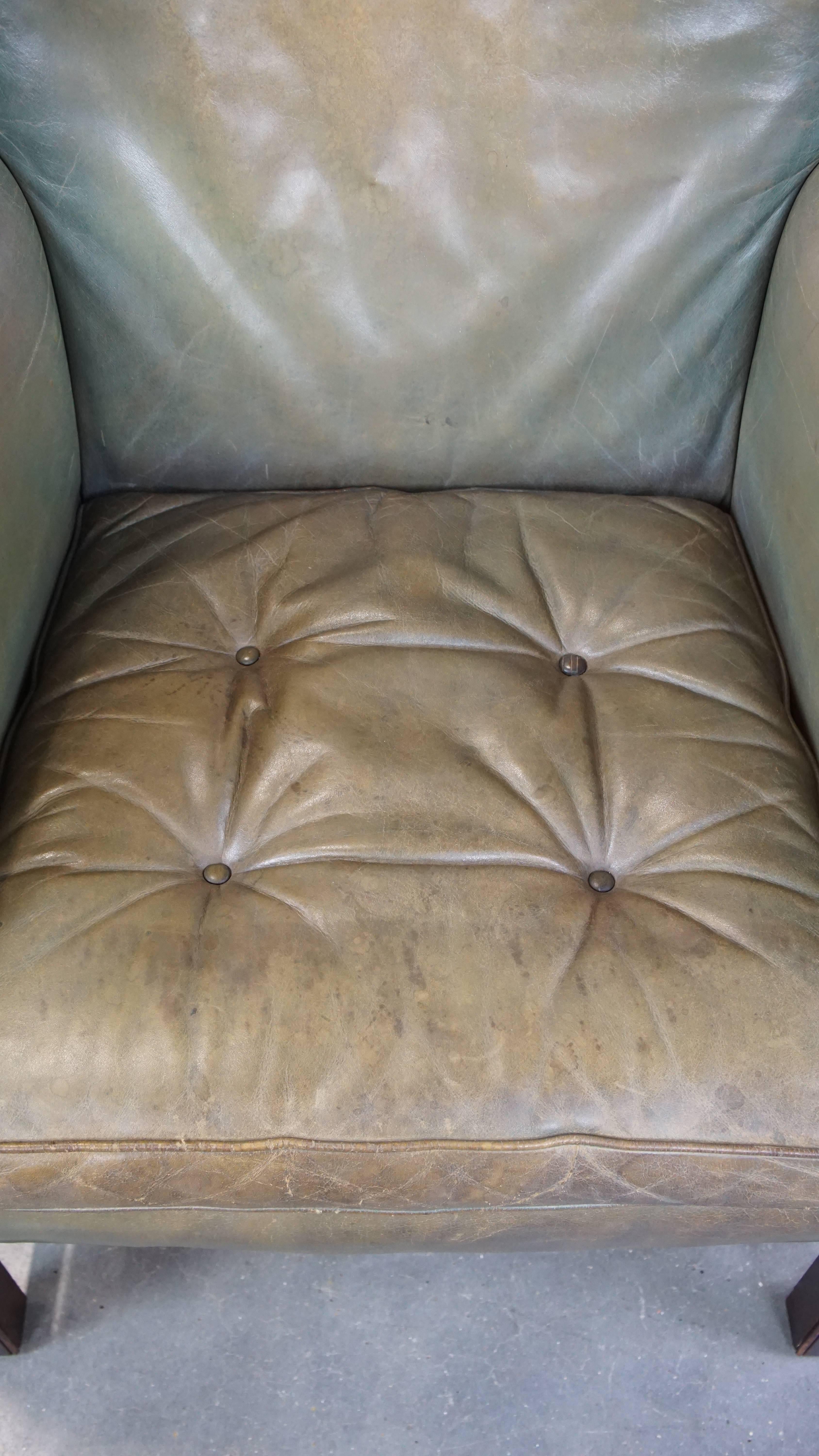 Cowhide Unique and characterful green cowhide leather armchair with a beautiful patina For Sale