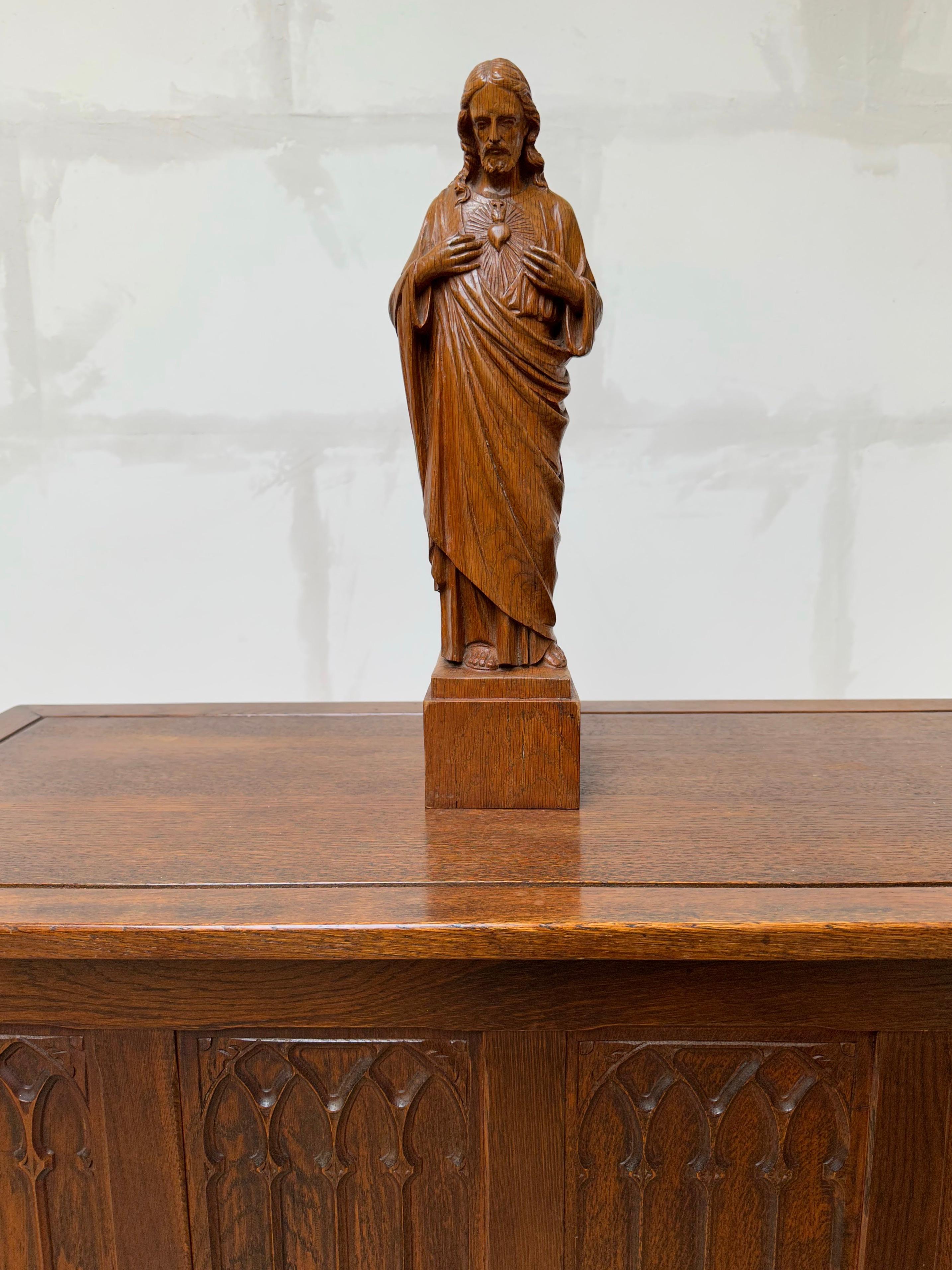 Striking and meaningful work of religious art.

This beautifully hand carved and good size Sacred Heart of Christ statuette is another one of our recent great finds. In our view the sculptor has perfectly managed to capture both the wisdom and