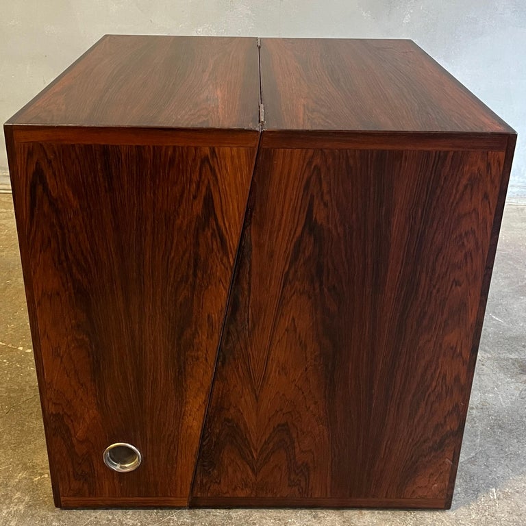 Scandinavian Danish Modern at its finest. Likely unique piece as we have found no other example. Rosewood with brass hinges and circular inserts pulls on either side. Box shape 20'' cubed looks beautiful with striking rosewood grain. Each of there 4