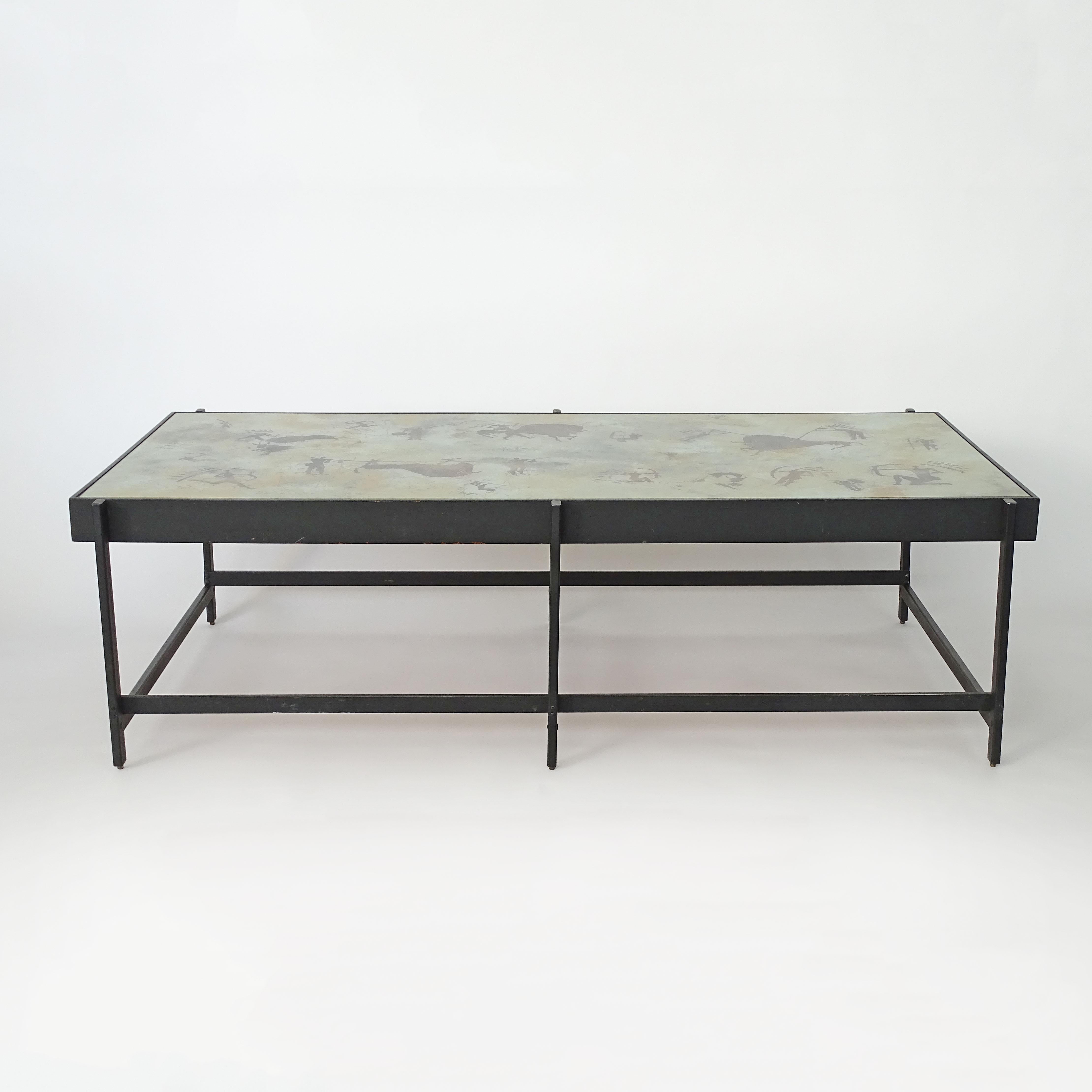 Unique and Monumental Coffee table attributed to Dubé for Fontana Arte.
The architectural metal structure holds a black painted wooden frame with a cased Duilio Dubé Bernabe Cave Drawings reverse painted glass.


