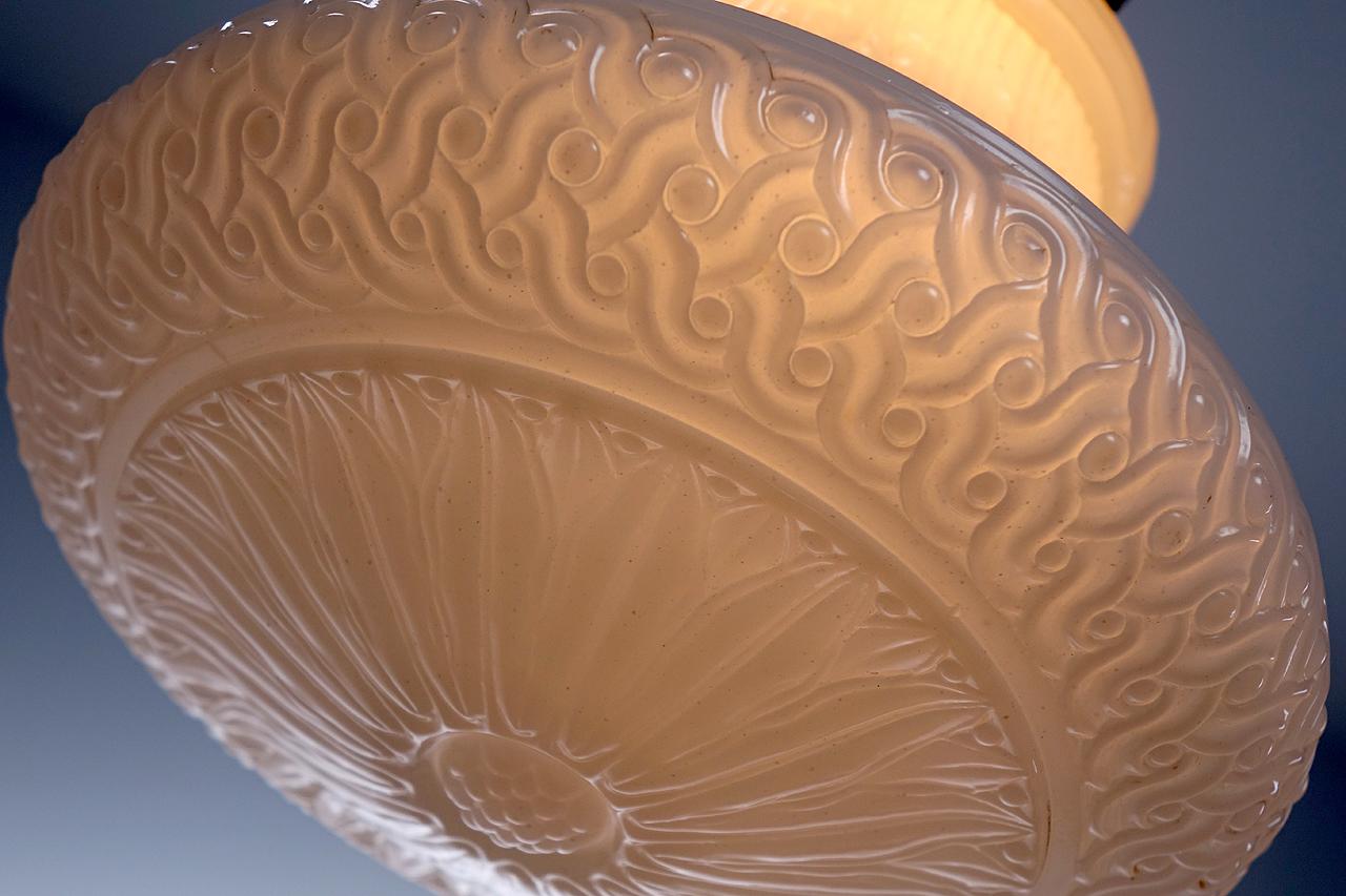 The dramatic profile and sunflower pattern make this 10 inch diameter shade a standout. They are signed Reflectolite and dated 1921. All include the original shade holder, socket and ceiling canopy. We have a small collection in stock that are