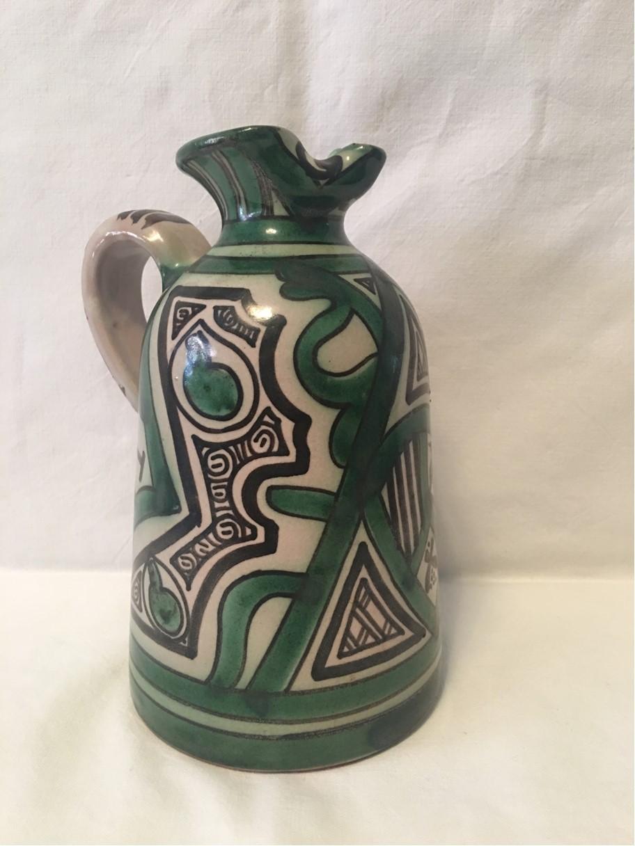 A great looking unique and powerful Ceramic Pitcher signed by the creator Domingo Punter of Spain. From the 1060's it reflects the bright outlook of the era. A good deco piece for any room sure to draw attention with its colorful motives.