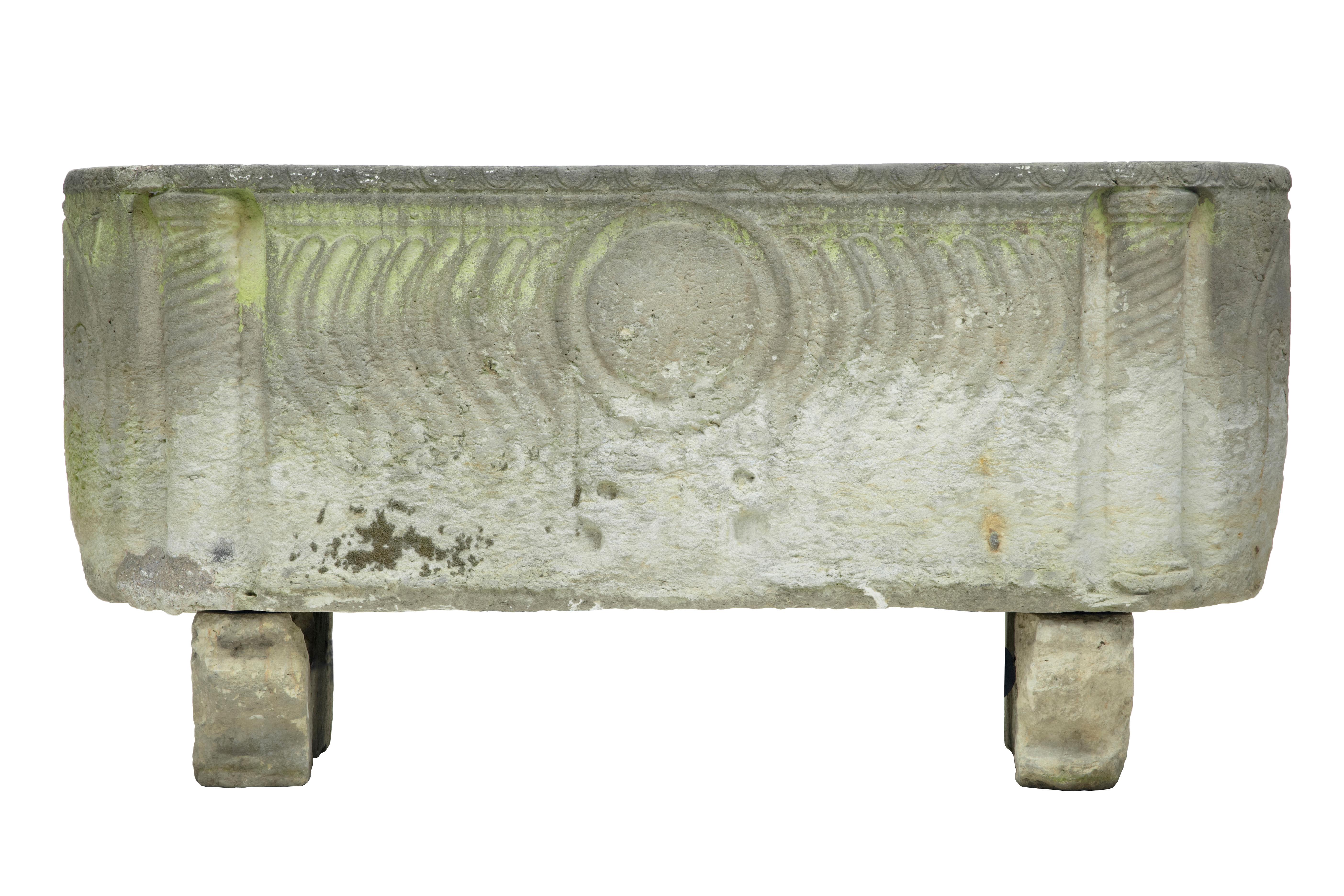 A stunning Anglo Roman sarcophagus in limestone, sitting on sledge feet and having curved strigilated side carvings with warrior shield and two crossed arrow symbols at each end, circa 250 AD. This unique piece was discovered in a Copenhagen garden.