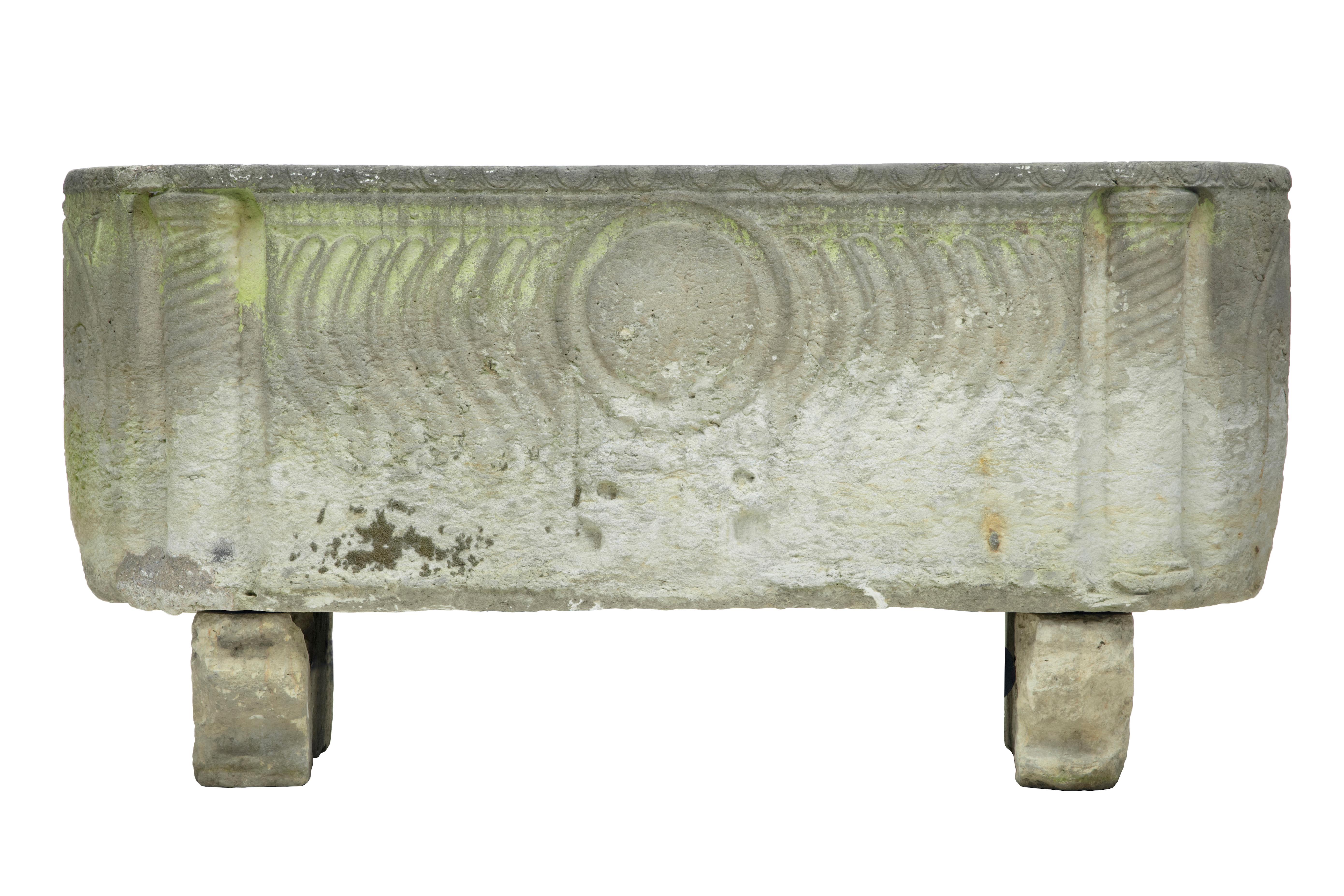 circa 250 AD. A stunning Anglo Roman sarcophagus in limestone, sitting on sledge feet and having curved strigilated side carvings with warrior shield and two crossed arrow symbols at each end.This unique piece was discovered in a Copenhagen garden.