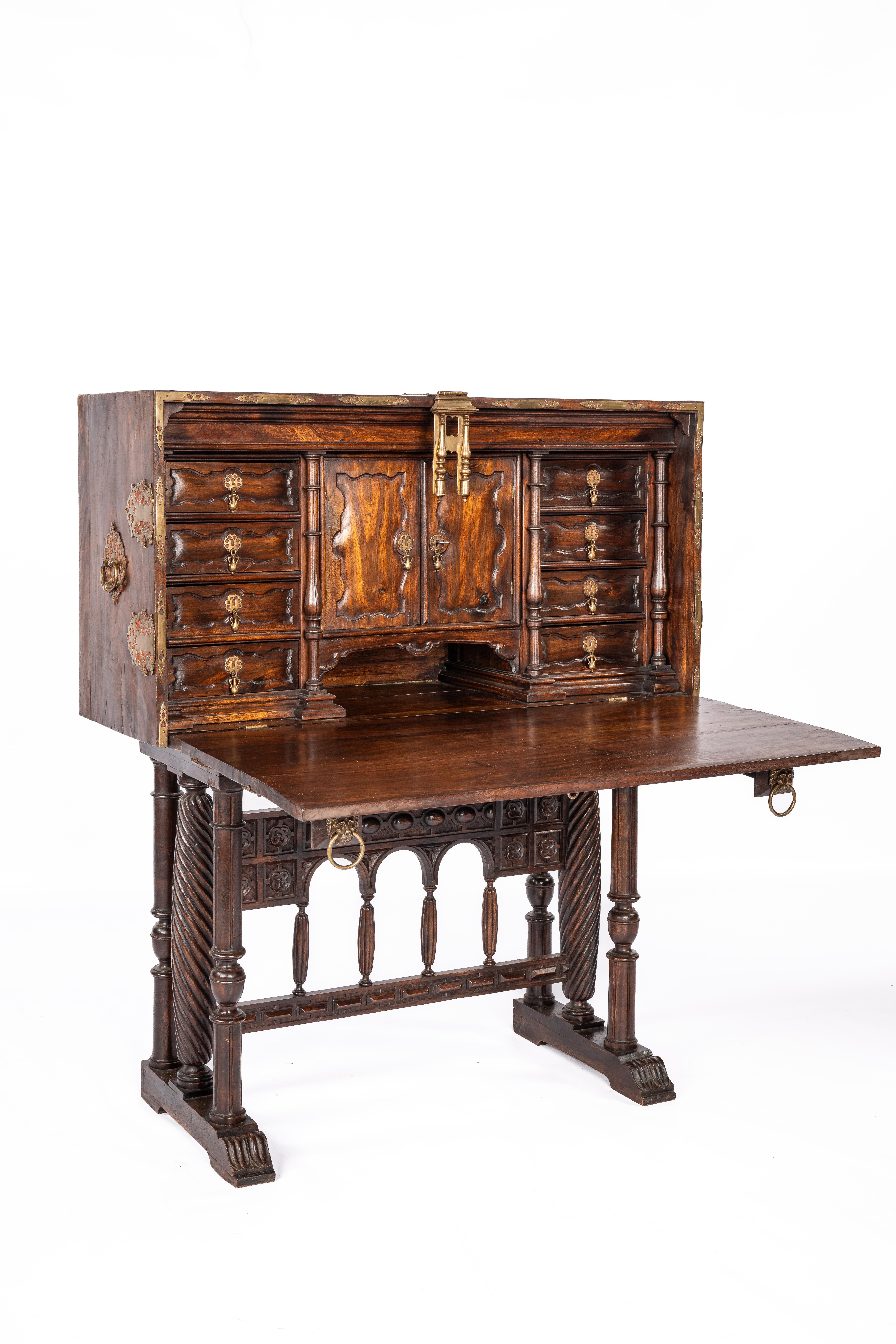 On offer here is an exceptional Spanish Renaissance bargueño, crafted in the mid 19th century, from solid chestnut wood. This masterpiece, with its warm brown color, exudes timeless elegance that fits perfectly into any interior.
The bargueño is