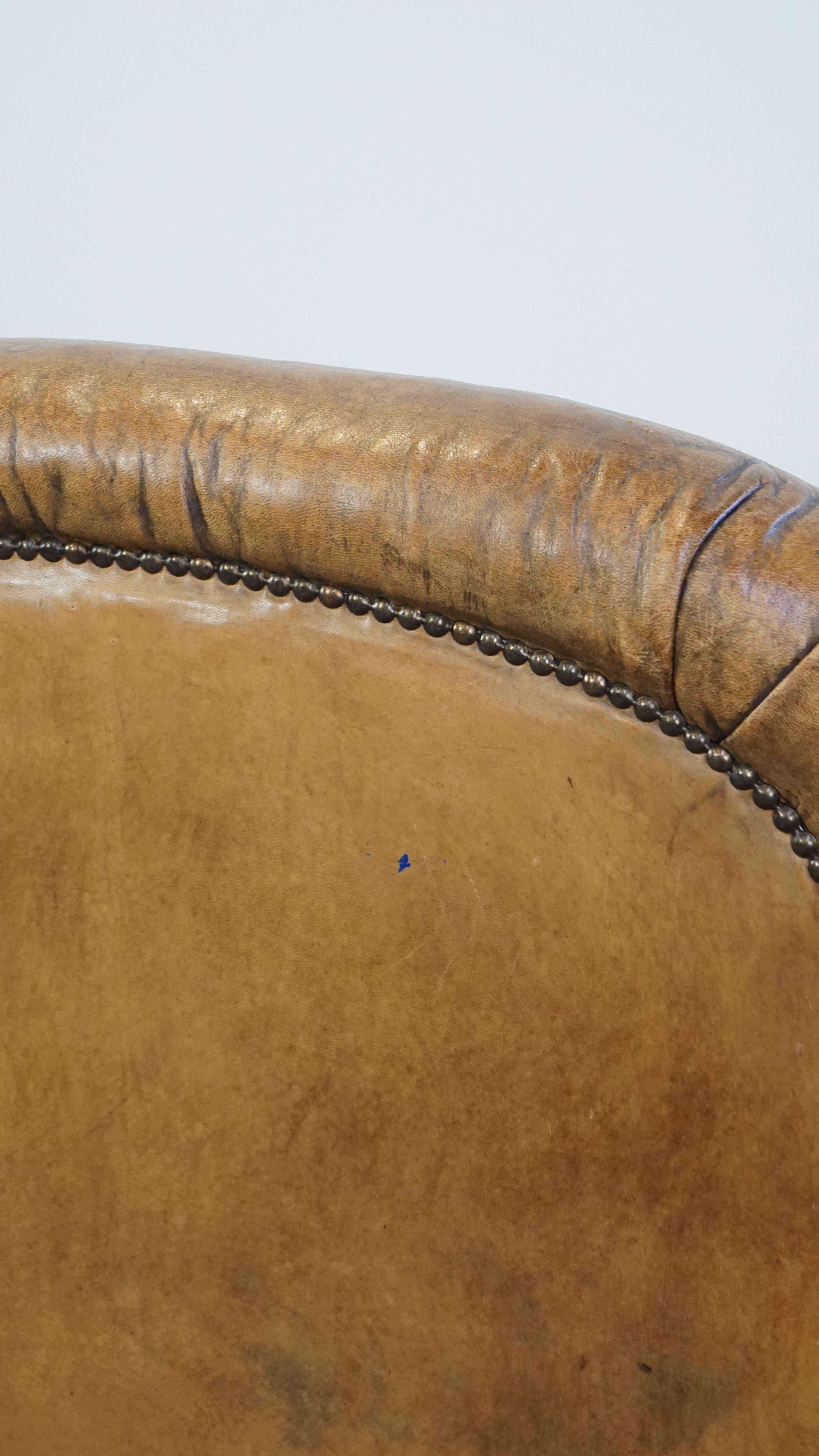 Unique antique armchair made of sheepskin with beautiful, elegant legs For Sale 4