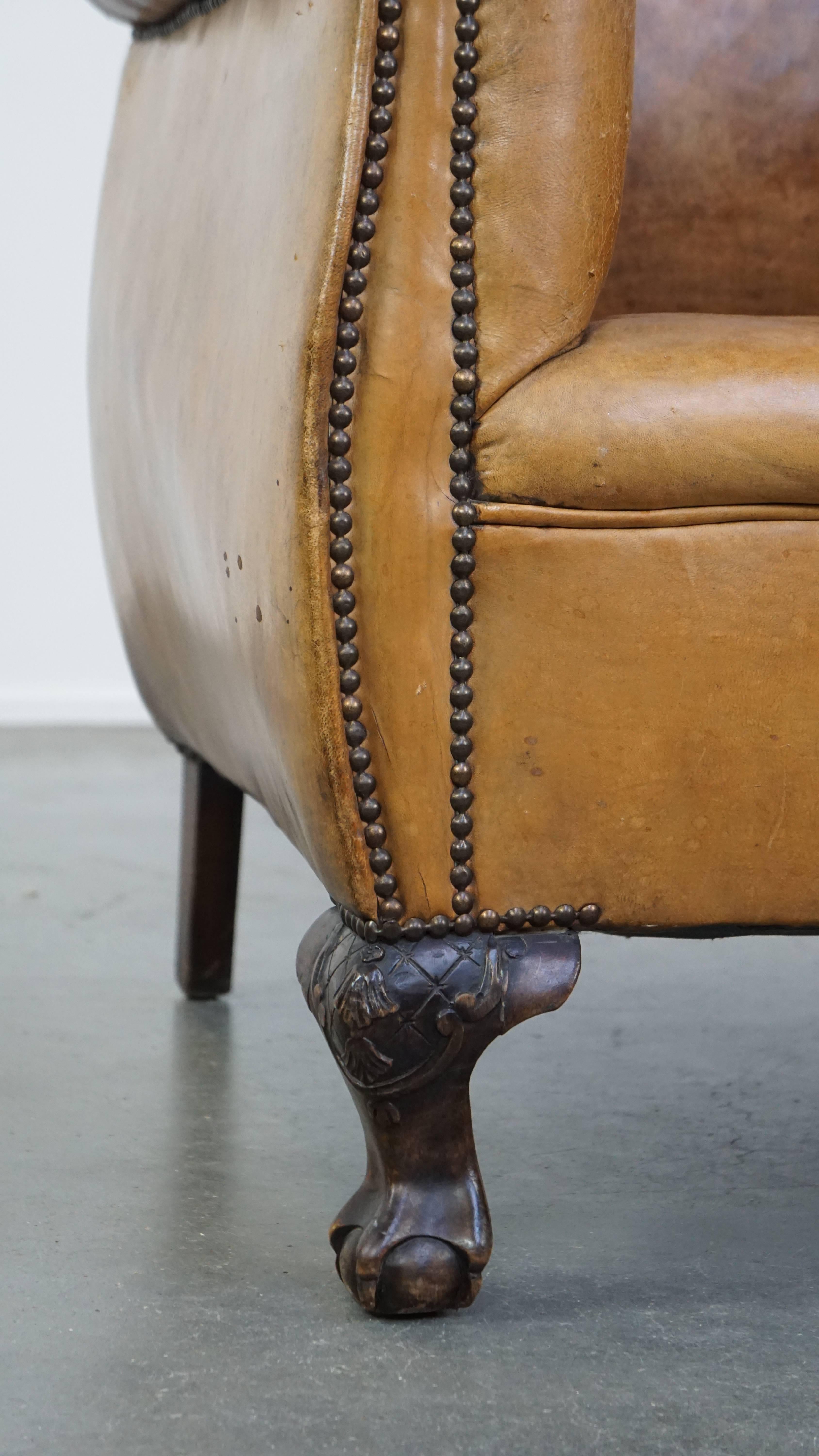 Unique antique armchair made of sheepskin with beautiful, elegant legs For Sale 8
