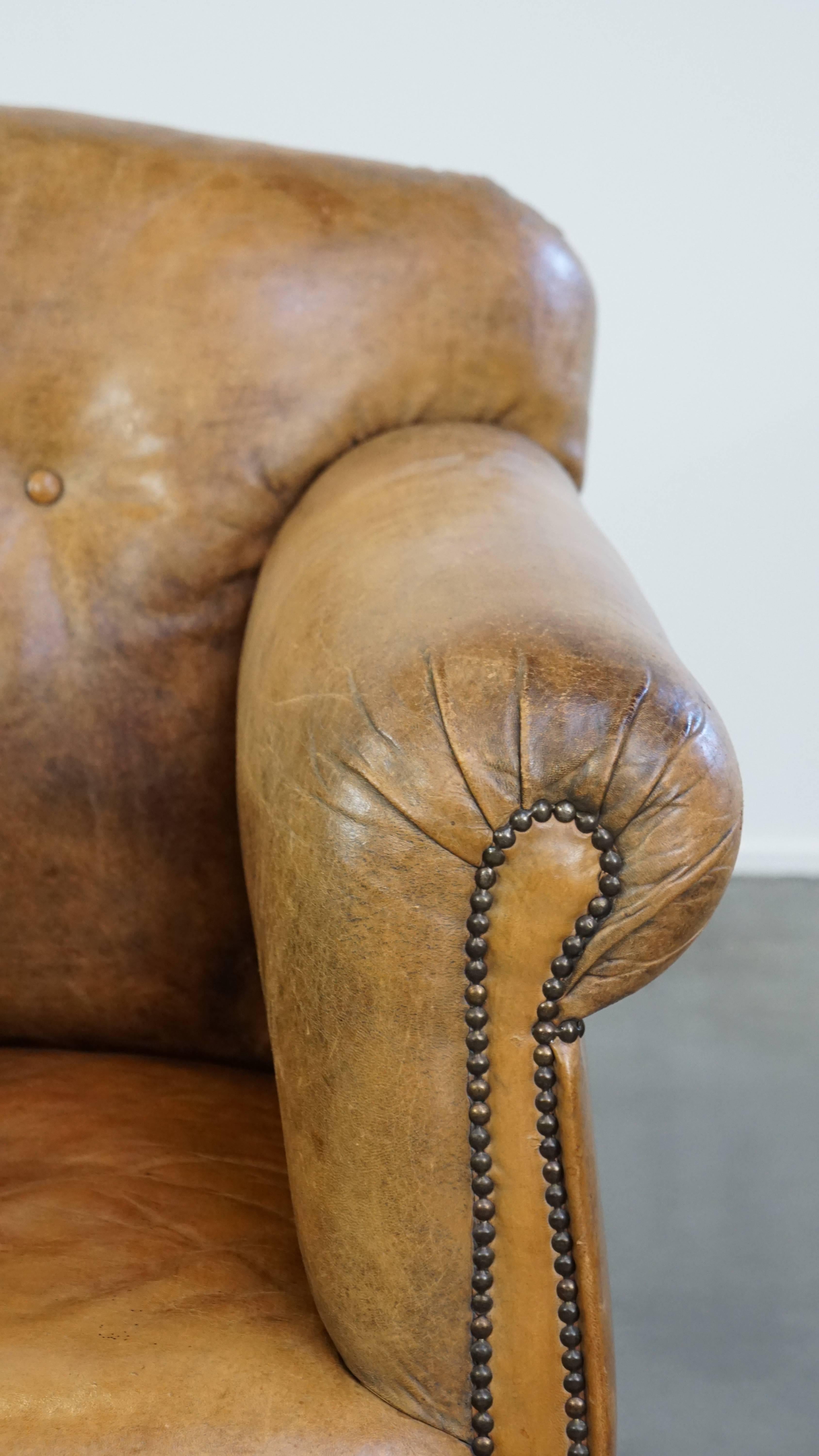 Unique antique armchair made of sheepskin with beautiful, elegant legs For Sale 9