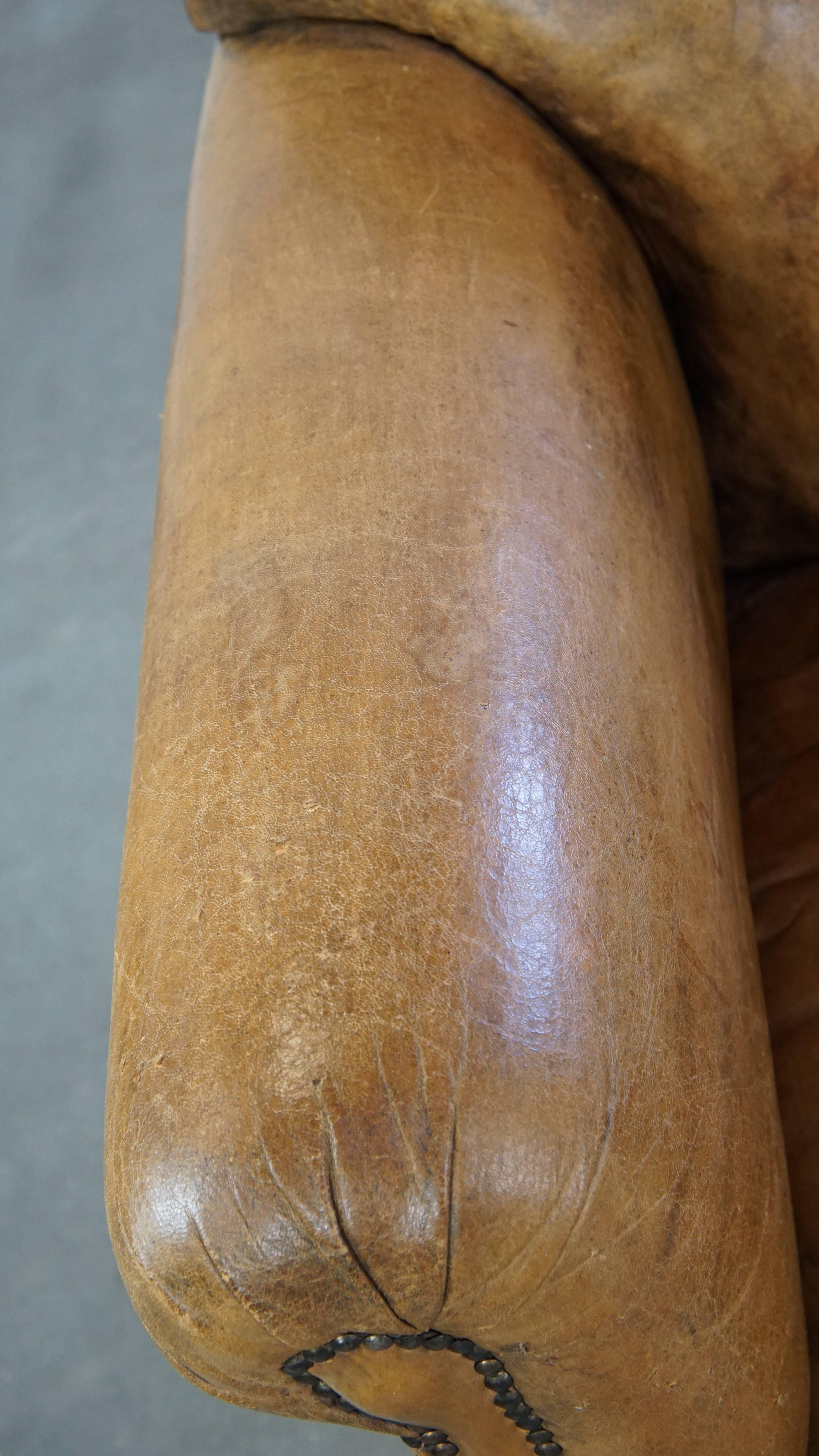 Unique antique armchair made of sheepskin with beautiful, elegant legs For Sale 1