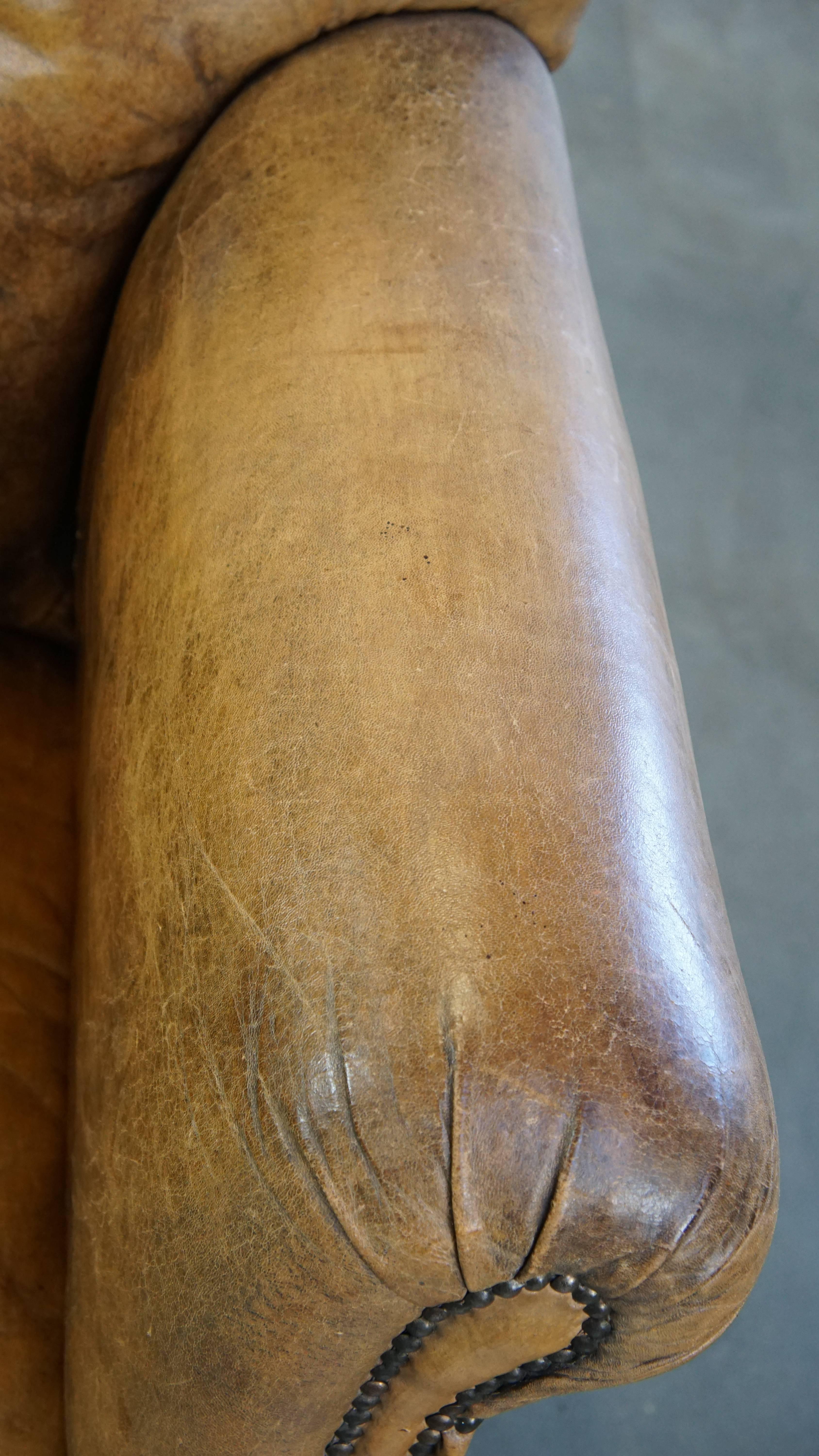 Unique antique armchair made of sheepskin with beautiful, elegant legs For Sale 2