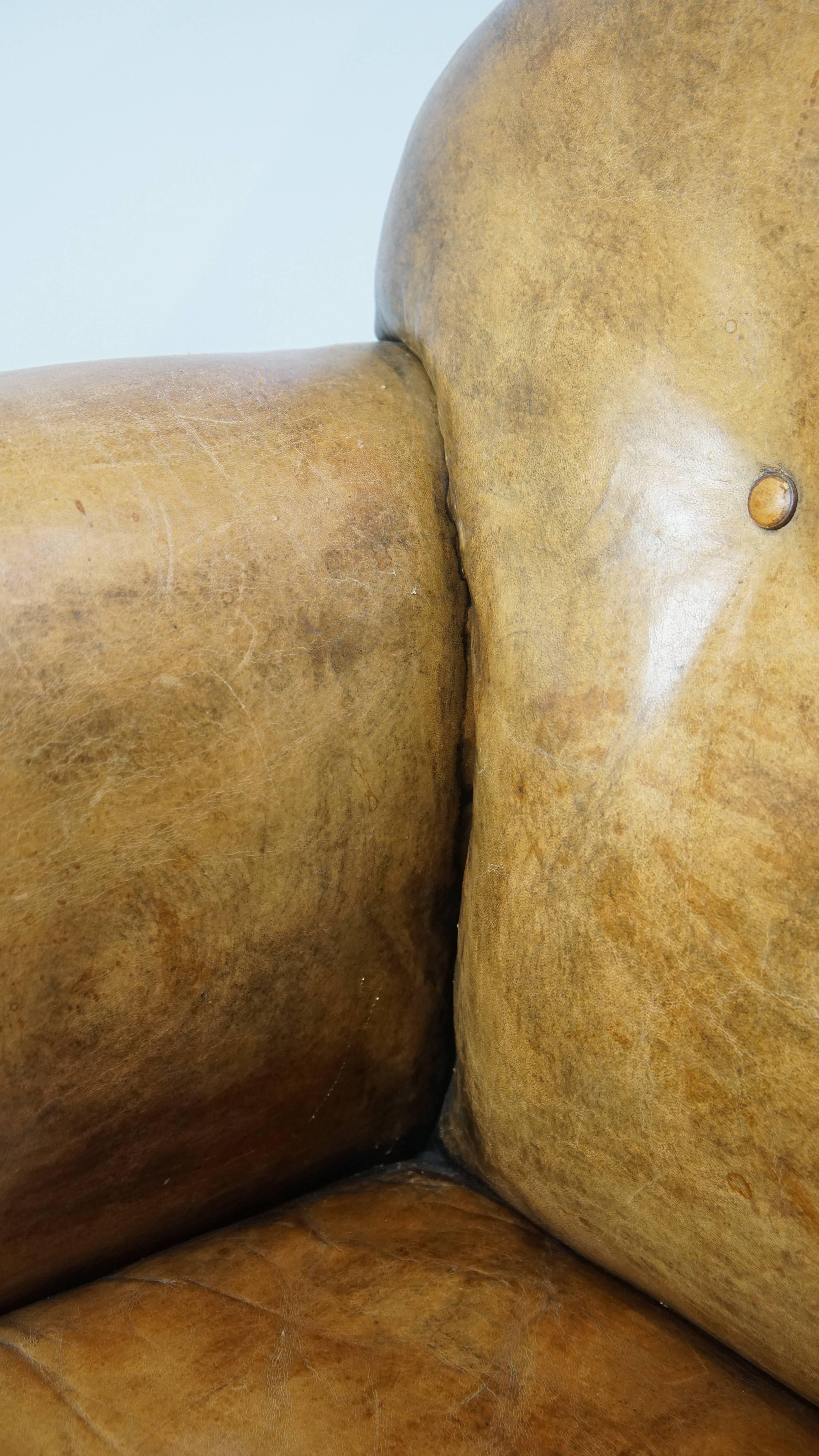 Unique antique armchair made of sheepskin with beautiful, elegant legs For Sale 3