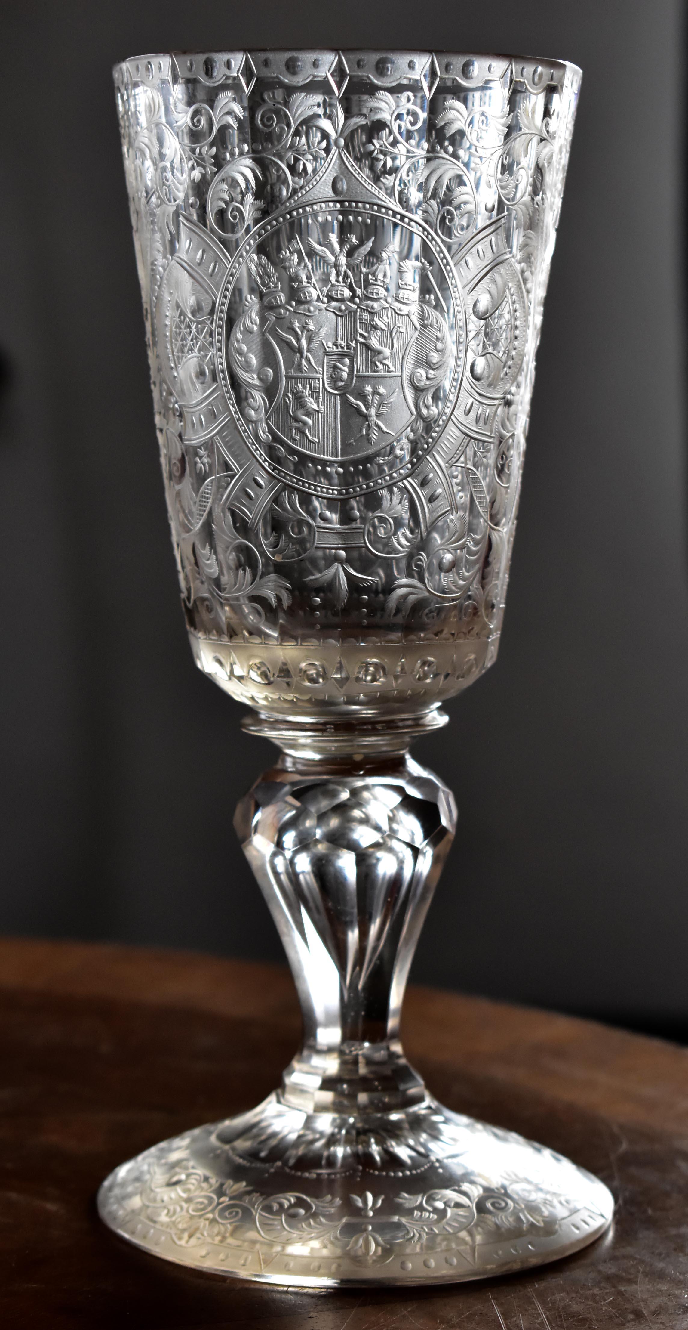 A unique antique cut glass cup with an engraving of the coat of arms of the famous noble family of Spork. Mention of this family dates back to the 16th century, their entire history can be traced. This is a clear goblet with facet cutting and very