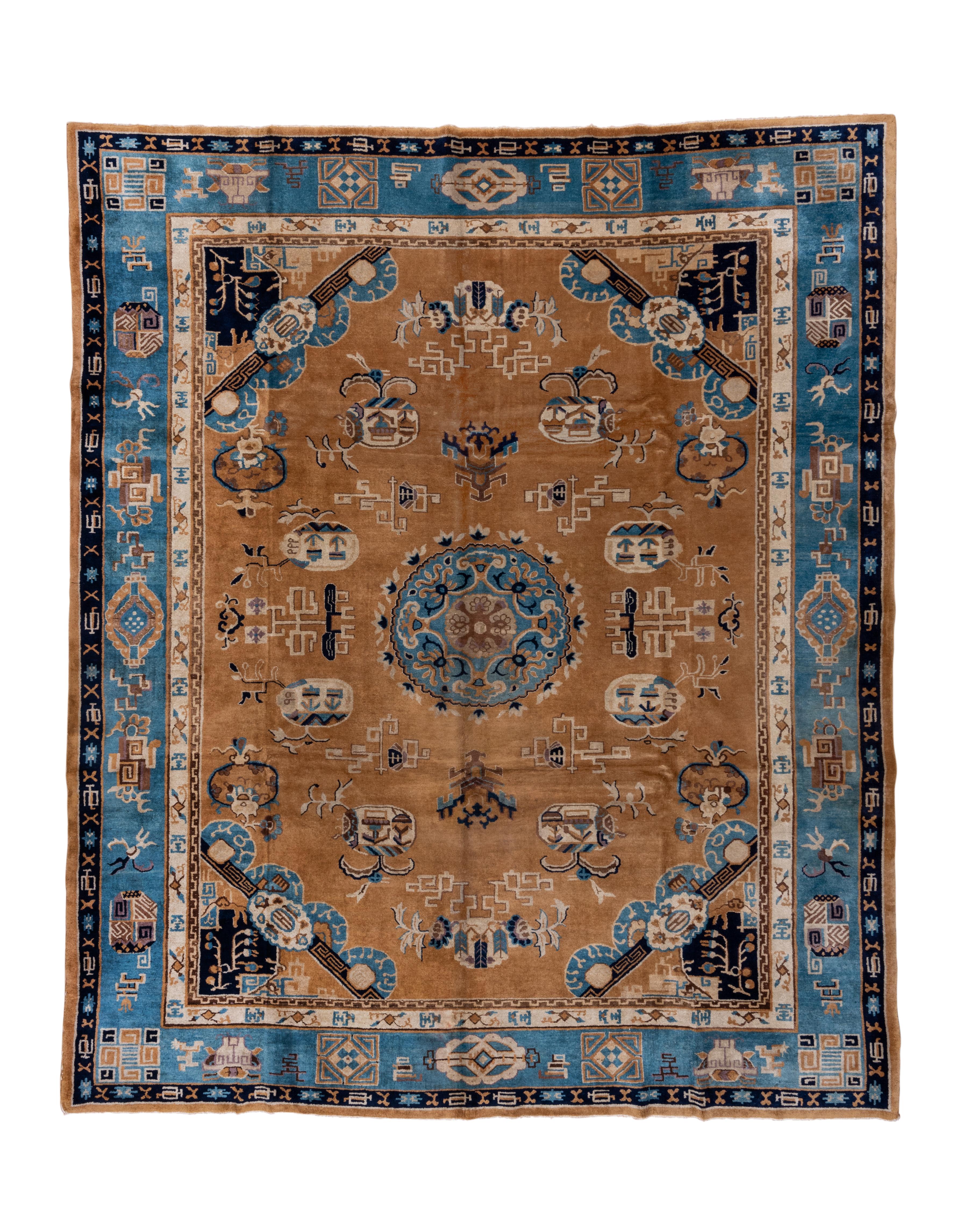 This is a totally wild carpet, from the rust field, through the scalloped light blue medallion with a central even arm cruciform, to the diagonally barred corners with little blue arches, to the light blue border  with its vessels, fretwork bits and