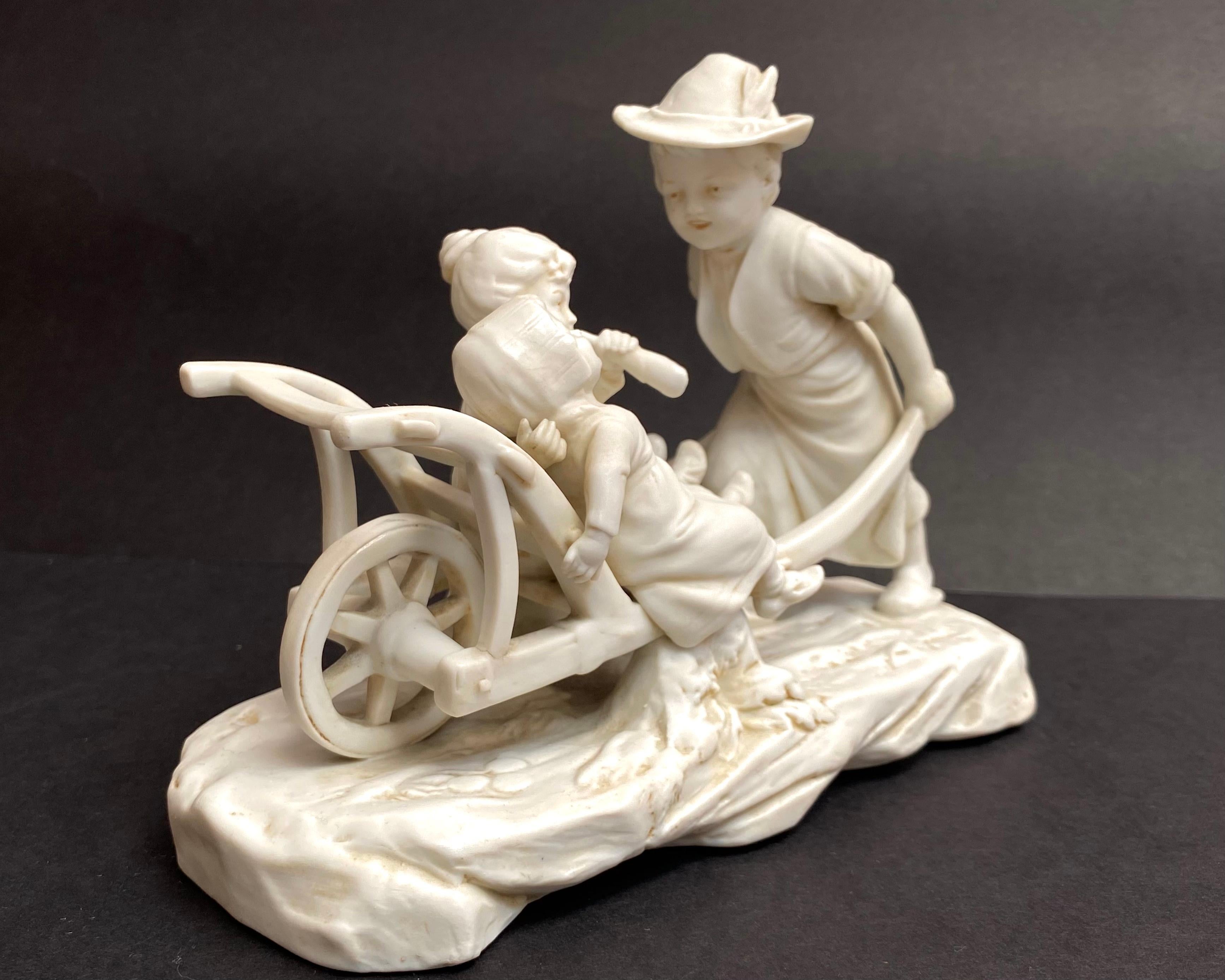The highly detailed German biscuit porcelain figurine. 

Early 20th century.

Very rare and outstanding hard-to-find figurine. This beautiful piece features Lady Pulling Cart with Two Girls. It has the finest detail.

Skillfully traced details