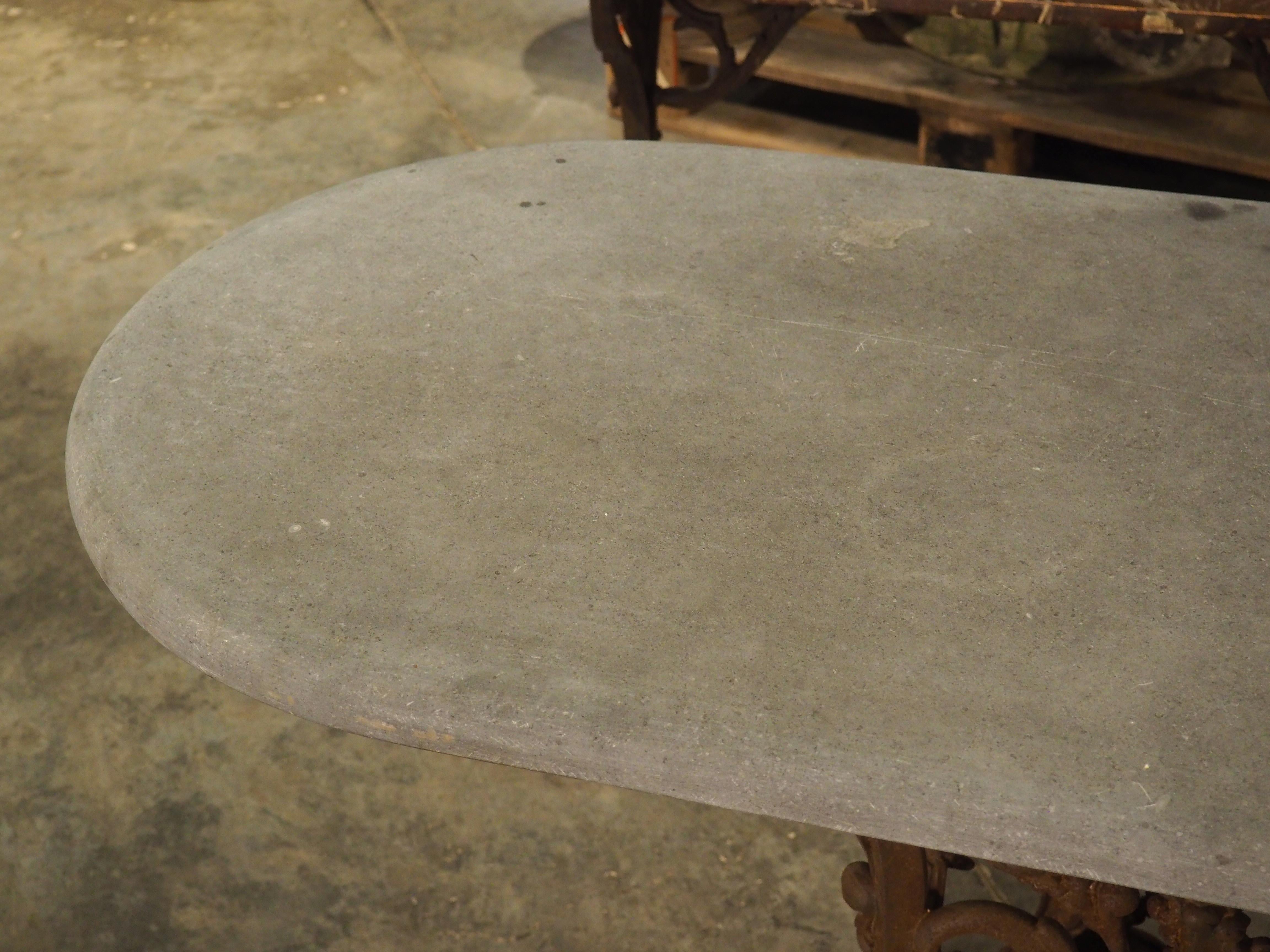 Hand-Carved Unique Antique French Cast Iron Table with Oval Bluestone Top, Circa 1900