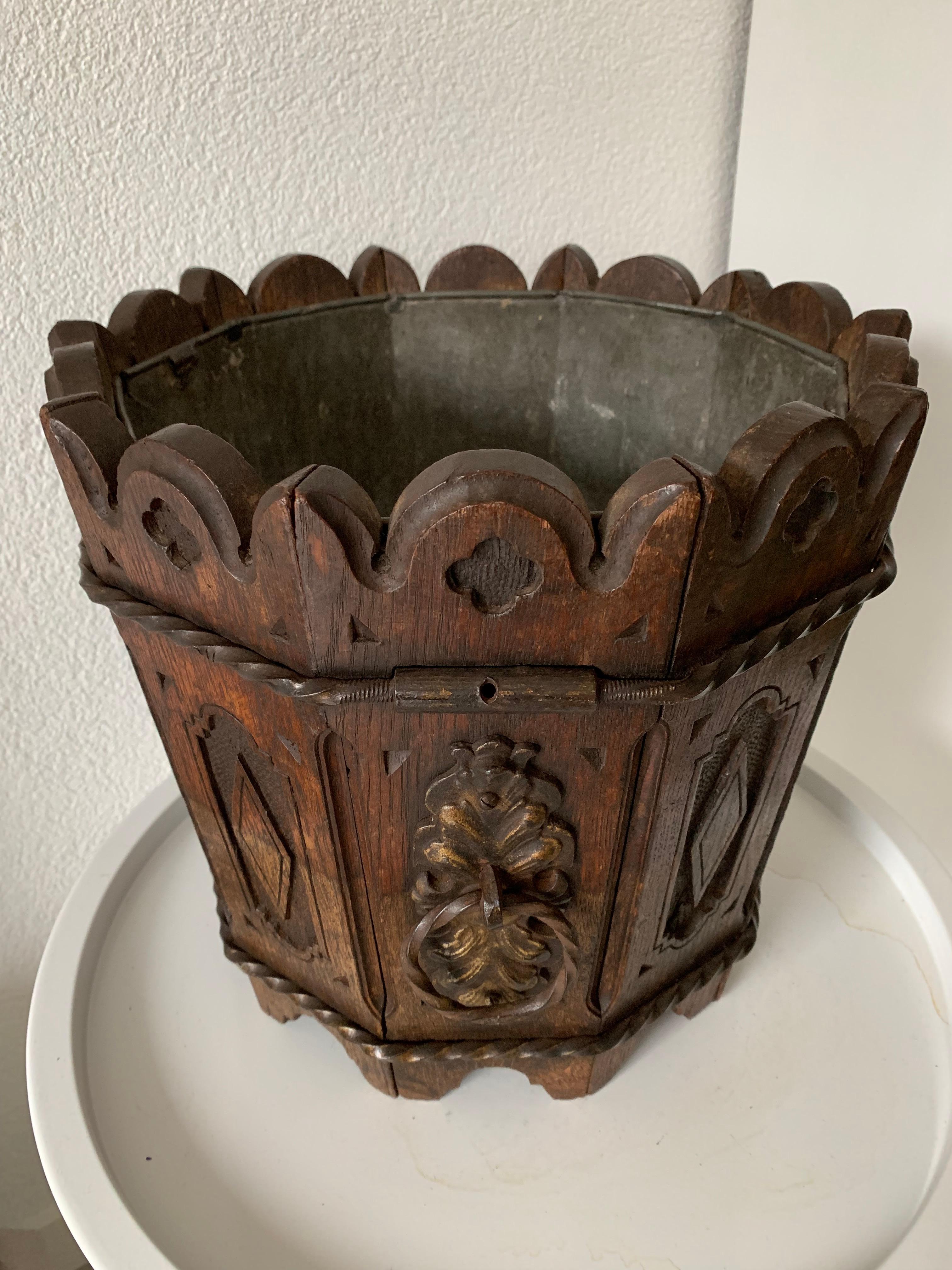 Early 1900s, hand carved planter with hand forged decorations and the original zinc liner.

If you like rare and stylish antiques then you will love this handcrafted, decagonal Gothic jardinière. The wonderful look and feel of this Gothic style