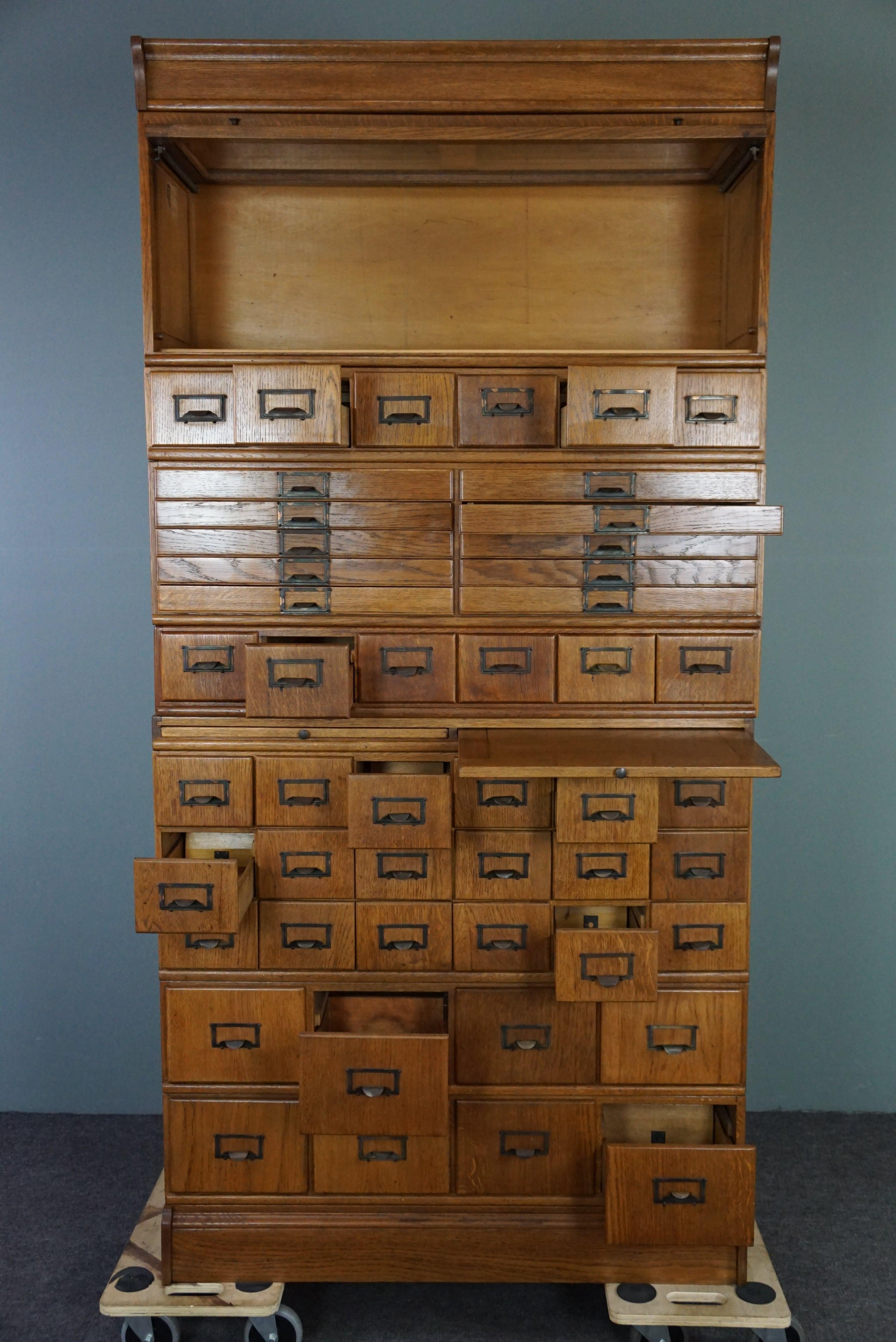 Unique antique oak pharmacy cabinet full of storage options, early 1900s In Good Condition For Sale In Harderwijk, NL