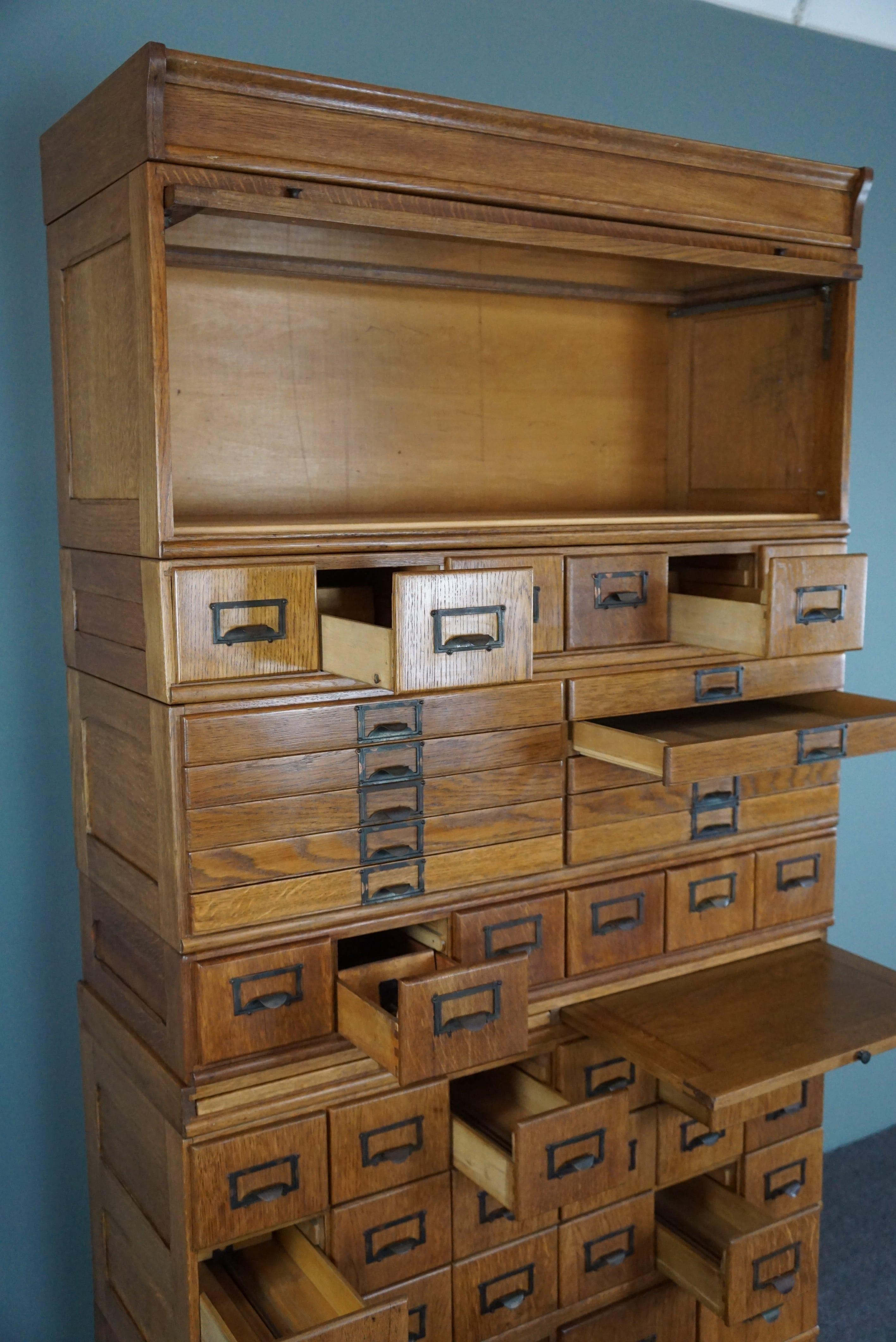 Wood Unique antique oak pharmacy cabinet full of storage options, early 1900s For Sale