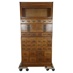 Unique Used oak pharmacy cabinet full of storage options, early 1900s
