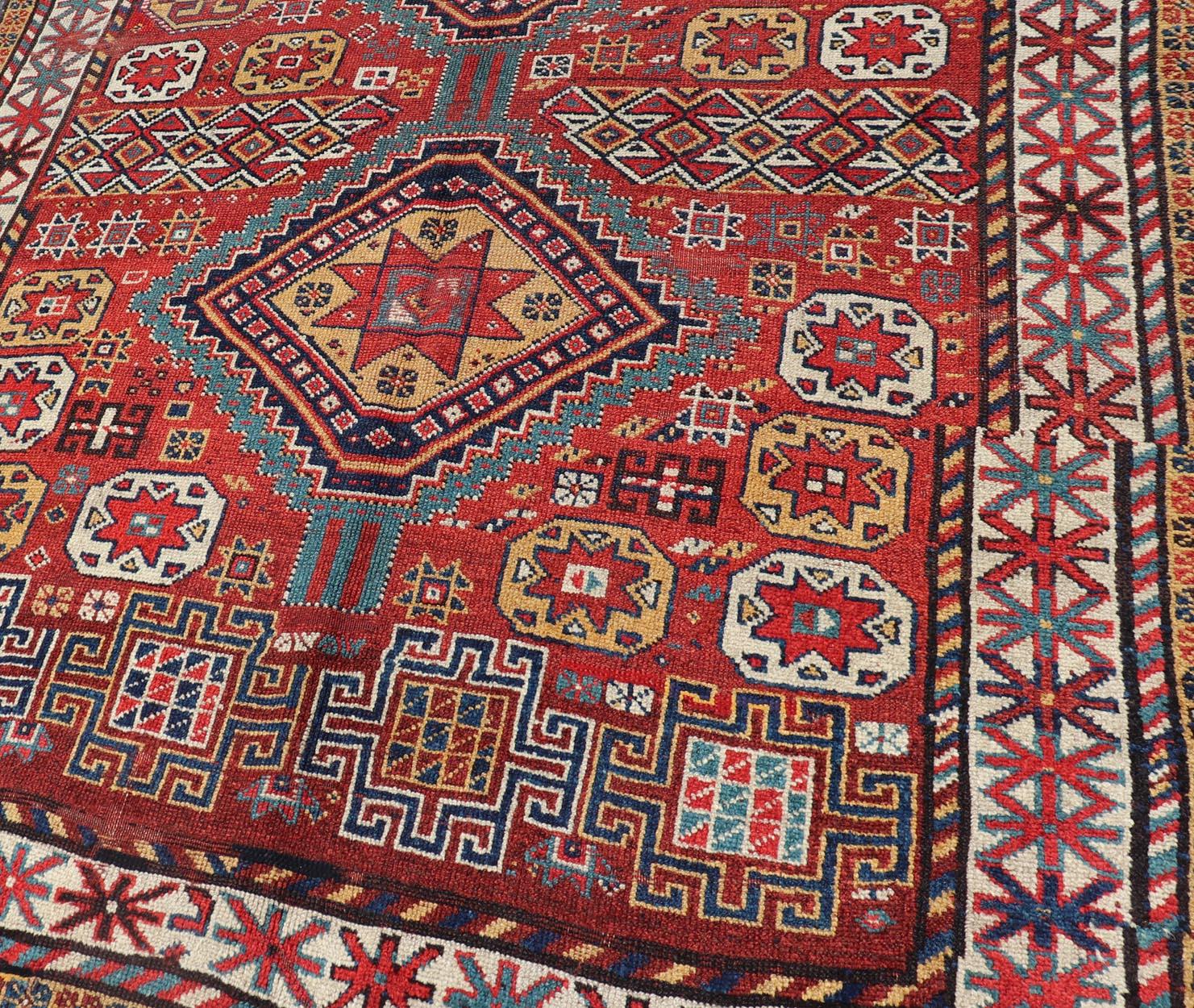 Hand-Knotted Unique Antique Qashqai Rug with Geometric Motifs in Red, Blue, and Golden Yellow For Sale