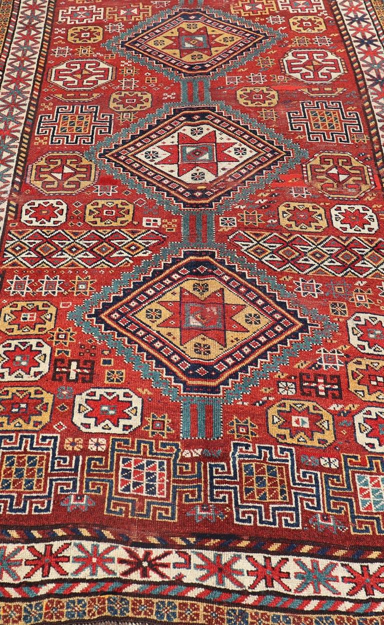 Unique Antique Qashqai Rug with Geometric Motifs in Red, Blue, and Golden Yellow In Good Condition For Sale In Atlanta, GA