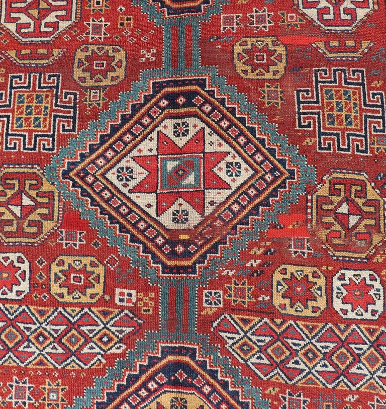 Wool Unique Antique Qashqai Rug with Geometric Motifs in Red, Blue, and Golden Yellow For Sale