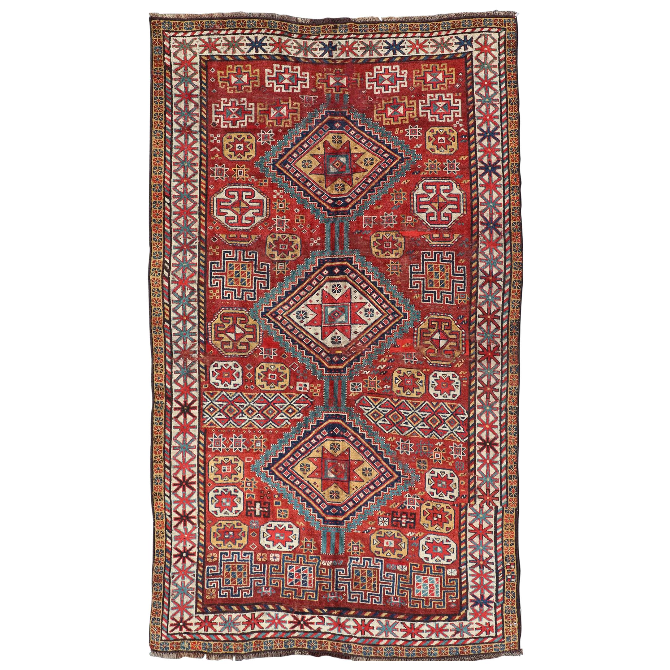 Unique Antique Qashqai Rug with Geometric Motifs in Red, Blue, and Golden Yellow