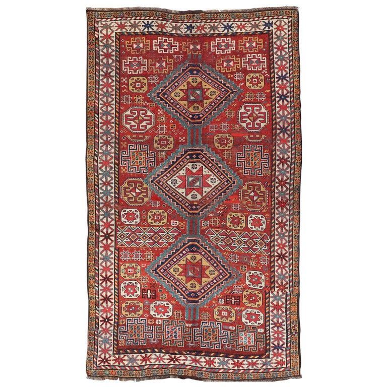 Unique Antique Qashqai Rug with Geometric Motifs in Red, Blue, and Golden Yellow For Sale