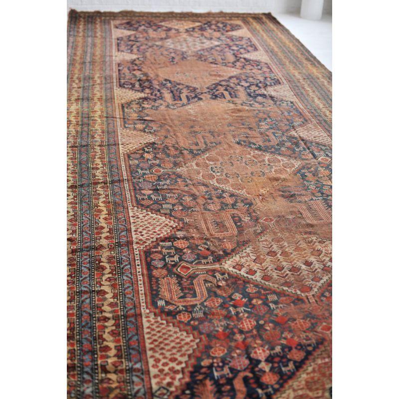 Super Rare Size Antique Runner Kelleh Southwest Beauty  Nomadic Animals, Pure Wool Gem with Navy, Camel, More

Size: 6.9 x 19.4
Age: Antique
Pile: Low with genuine distress and patina given its age, this piece has 3 small holes the size of a nickel