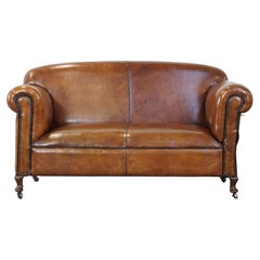 Unique antique sheepskin leather sofa, fully restored and reupholstered