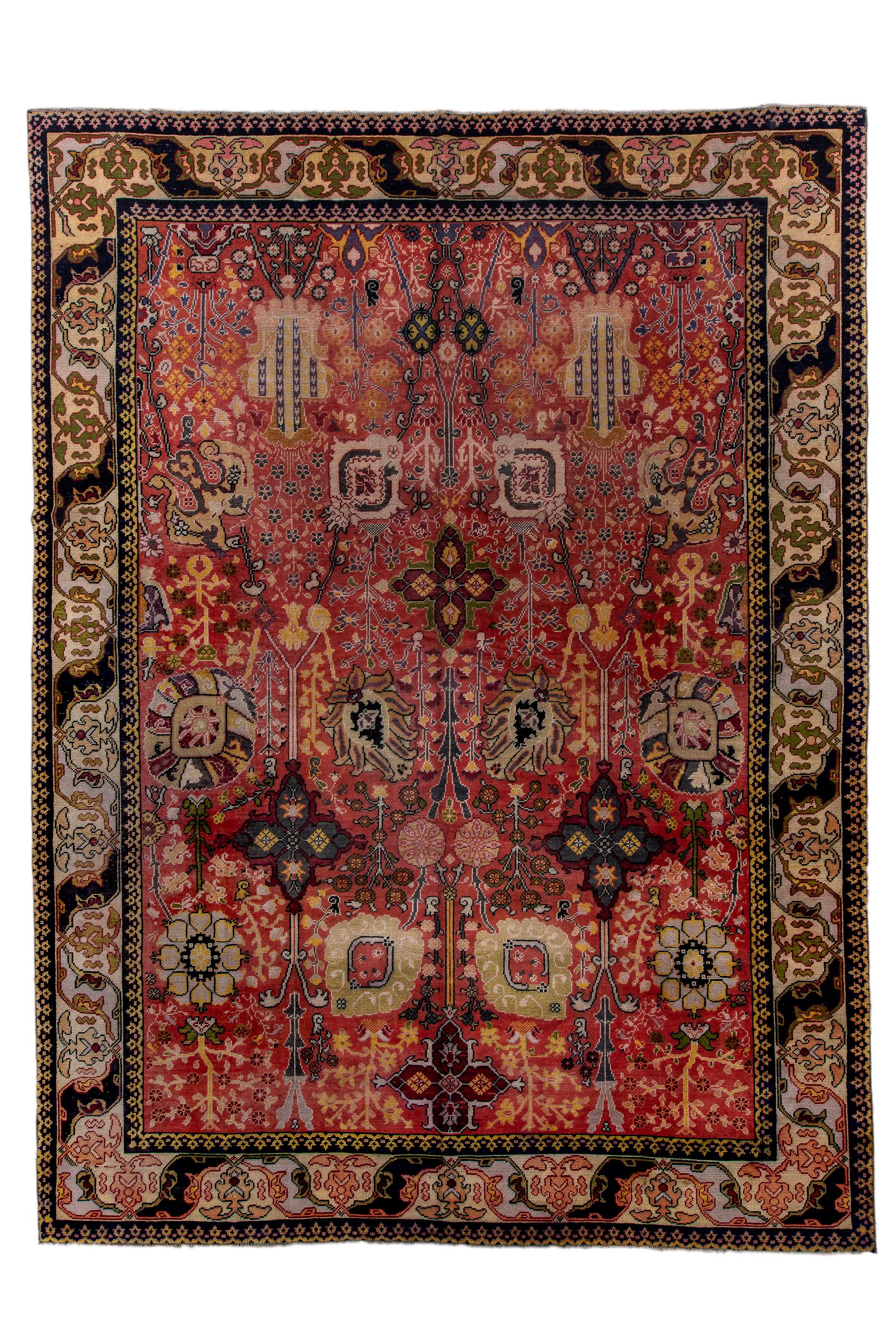 In a modified, Persianate “Vase carpet” design of oblique, banded oval palmettes, petal palmettes and  abstract iris amphora palmettes, all on a  Turkey red ground, this carpet was intended to compete, when new, with contemporaneous Persian rugs.