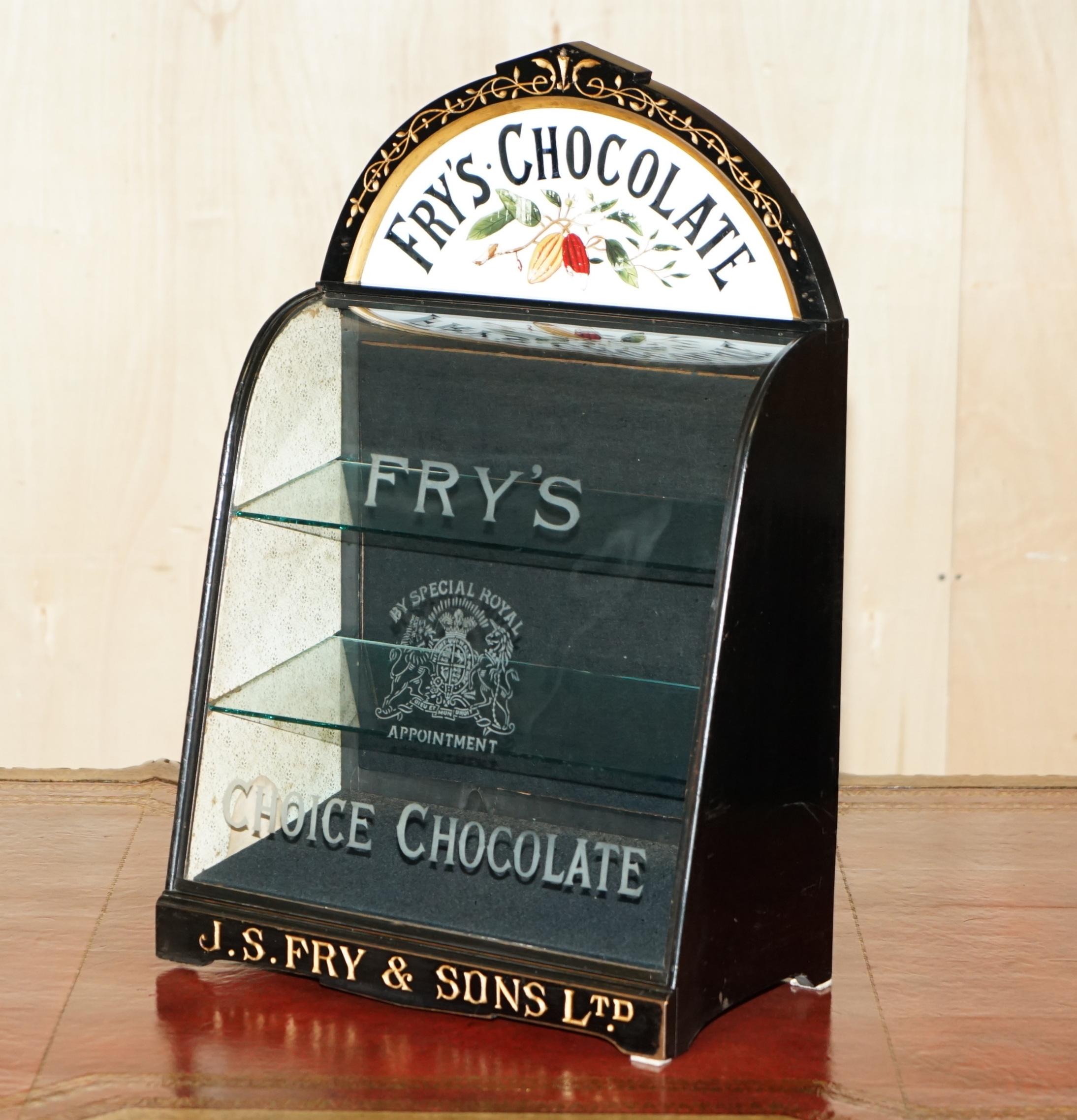 Royal House Antiques

Royal House Antiques is delighted to offer for sale this one of a kind, super unique, curved glass Fry’s Chocolate display case with the original water glass Armorial crest coat of arms etched front panel and never seen before,