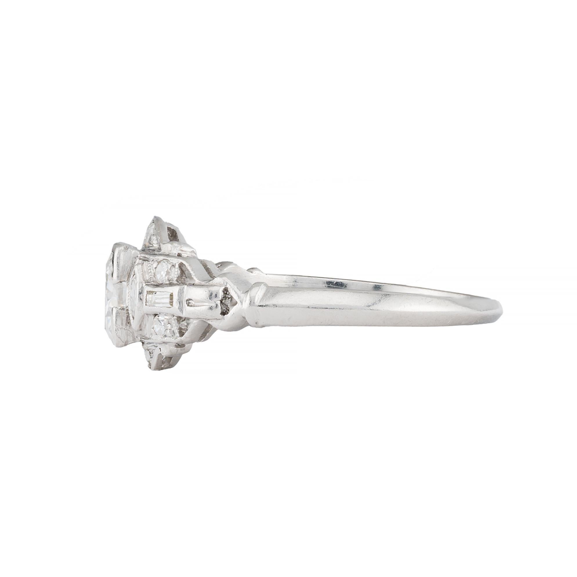 Aston Estate Jewelry Presents:

An exquisite engagement ring showcasing a 0.65 carat round diamond of VS2 clarity with G color. The diamond is set in a detailed mounting, accentuating its brilliance. The design features intricate geometric patterns.