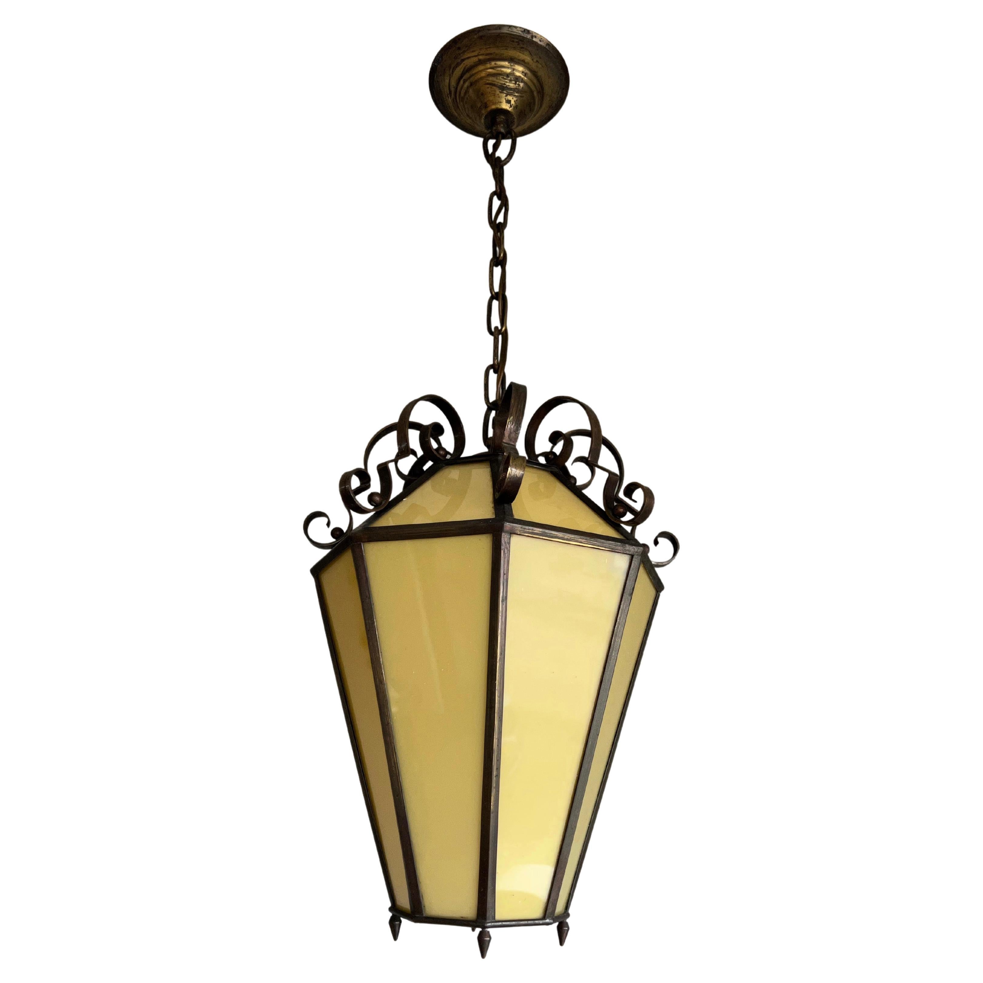 Handcrafted and stylish, Italian made pendant with 16 colored art glass panels.

If you are looking for a unique and stylish lantern-like pendant to grace your entry hall or landing then this handcrafted octagonal specimen from early twentieth