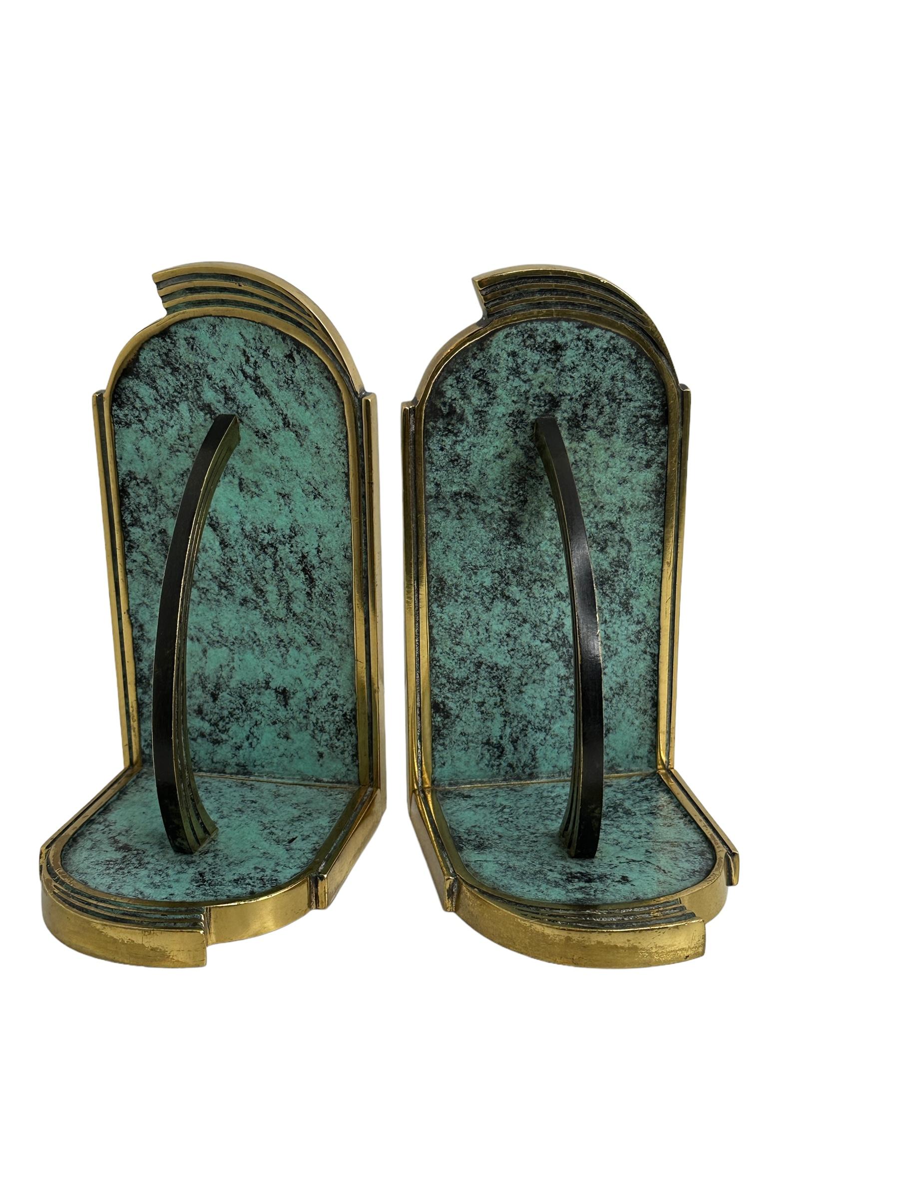 Channeling old world glamor into your home decor, this set of two brass bronze finish bookends is both a useful and decorative addition to your home office, library, study or lounge. Found at an estate sale in Vienna, Austria this pair will make a