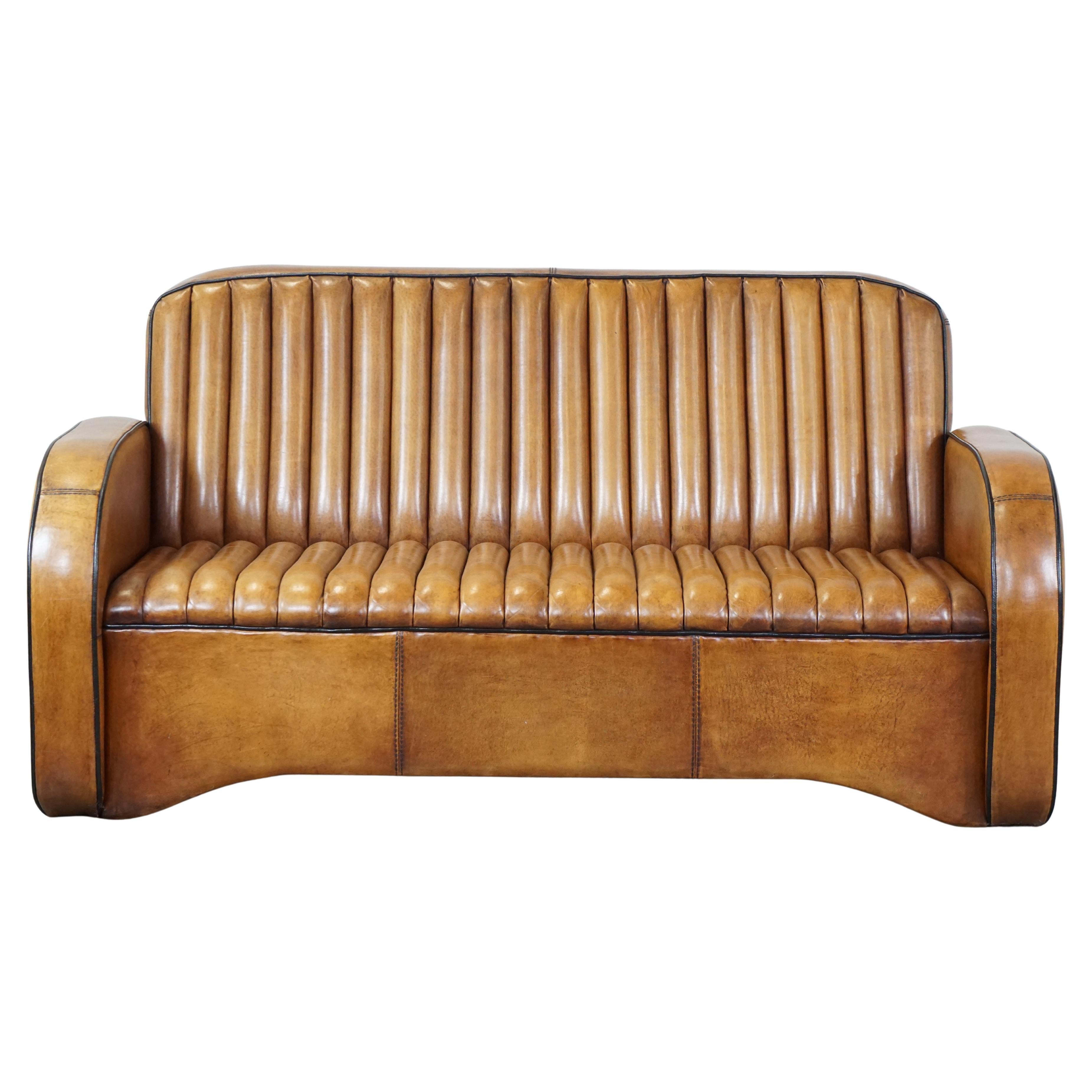 Unique Art Deco design 2.5 seater sheepskin sofa in very good condition
