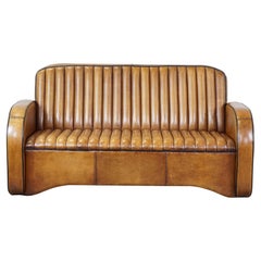 Unique Art Deco design 2.5 seater sheepskin sofa in very good condition