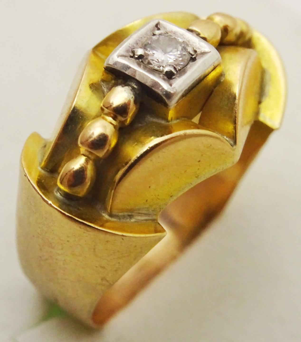 A very unique Ring from the Art Deco period , there are no hallmarks and the ring has been acid tested for 18 karat Gold  the gold itself has a rosy hue,
 A sculptural composition of a 4 mm good quality Diamond weighing approximately  25 points ( as
