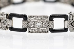 Unique Art Deco gold bracelet with diamonds and onyx, 1920s.
