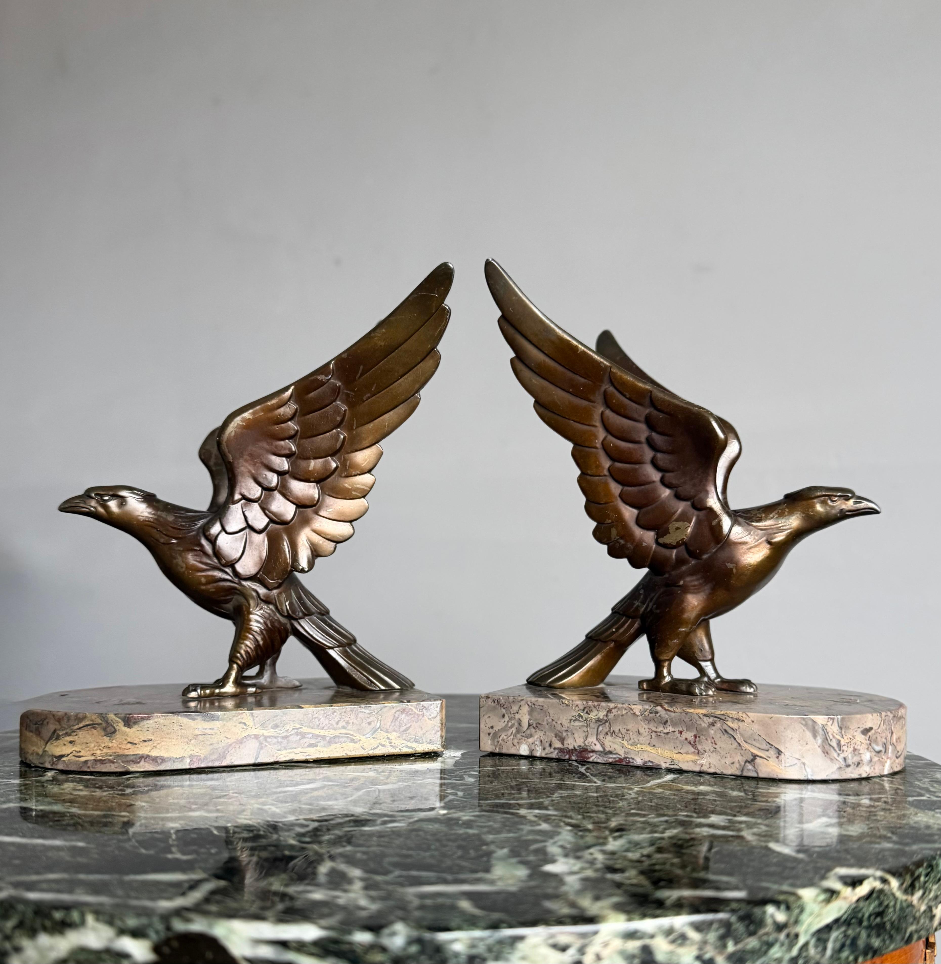 Original bronzed spelter and open wings eagle bookends on marble base, circa 1920.

If eagles hold a special meaning for you or for someone you love, then this unique pair of bookends could be the perfect gift. These beautifully stylised Art Deco