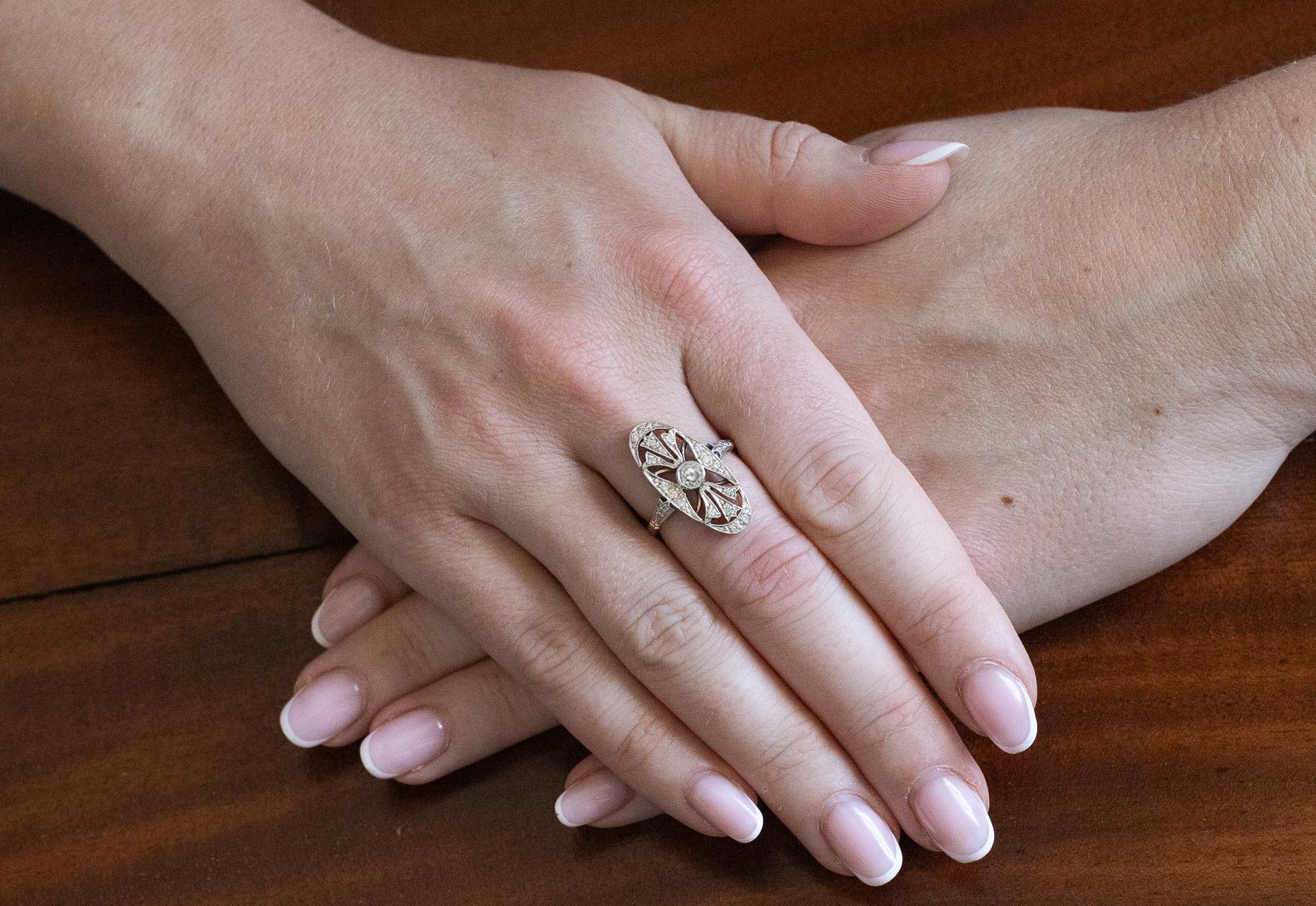 A vintage, elongated ring in a geometric Art Deco style, crafted from 14-karat yellow gold.

Origin: Hungary, preserved hallmark used between 1937 and 1965.

The ring is set centrally with a 0.20ct old brilliant-cut diamond (H-I color, SI1
