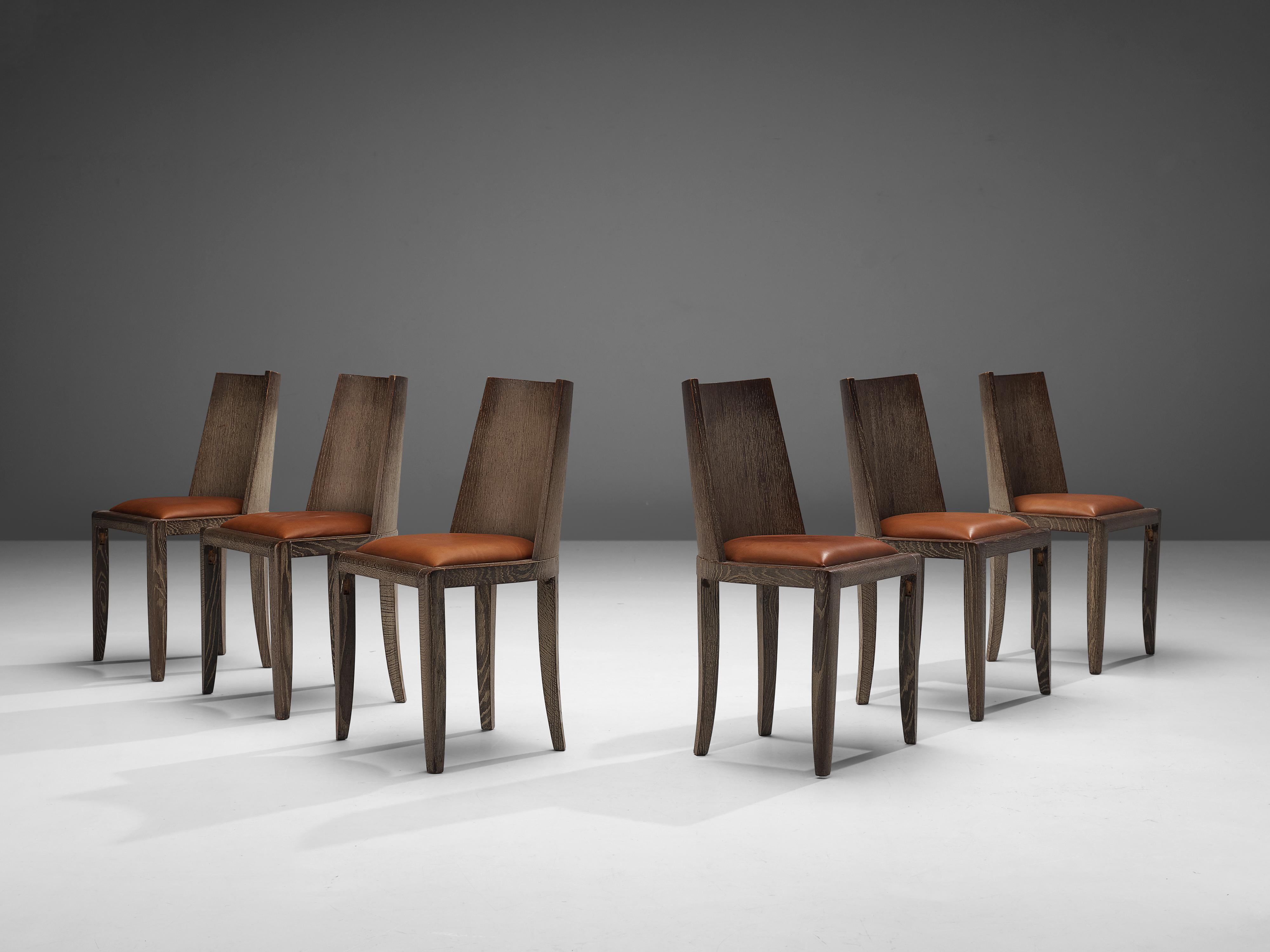 Set of six dining chairs, oak and leather, Belgium, 1930s 

These subtle and modest chairs feature cerused oak which gives these items an authentic and natural allure. This term refers to a unique finishing technique that showcases the beautiful