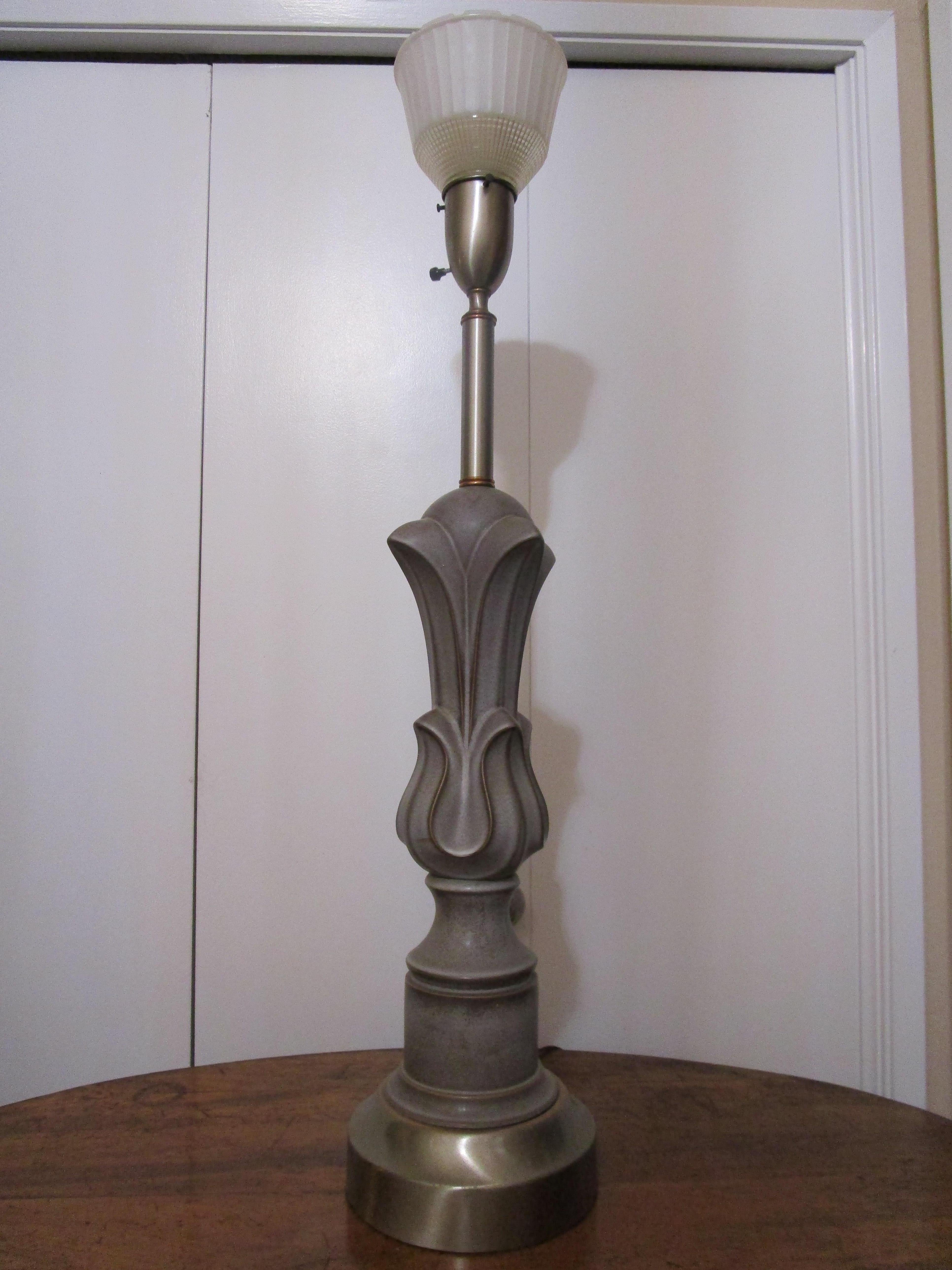 The art deco flair and materials, iron, copper and metal make this a standout for lovers of the design. Unique. This lamp was produced at the end of the deco period and shows all of the hallmarks of art deco. This is a unique standalone lamp that is
