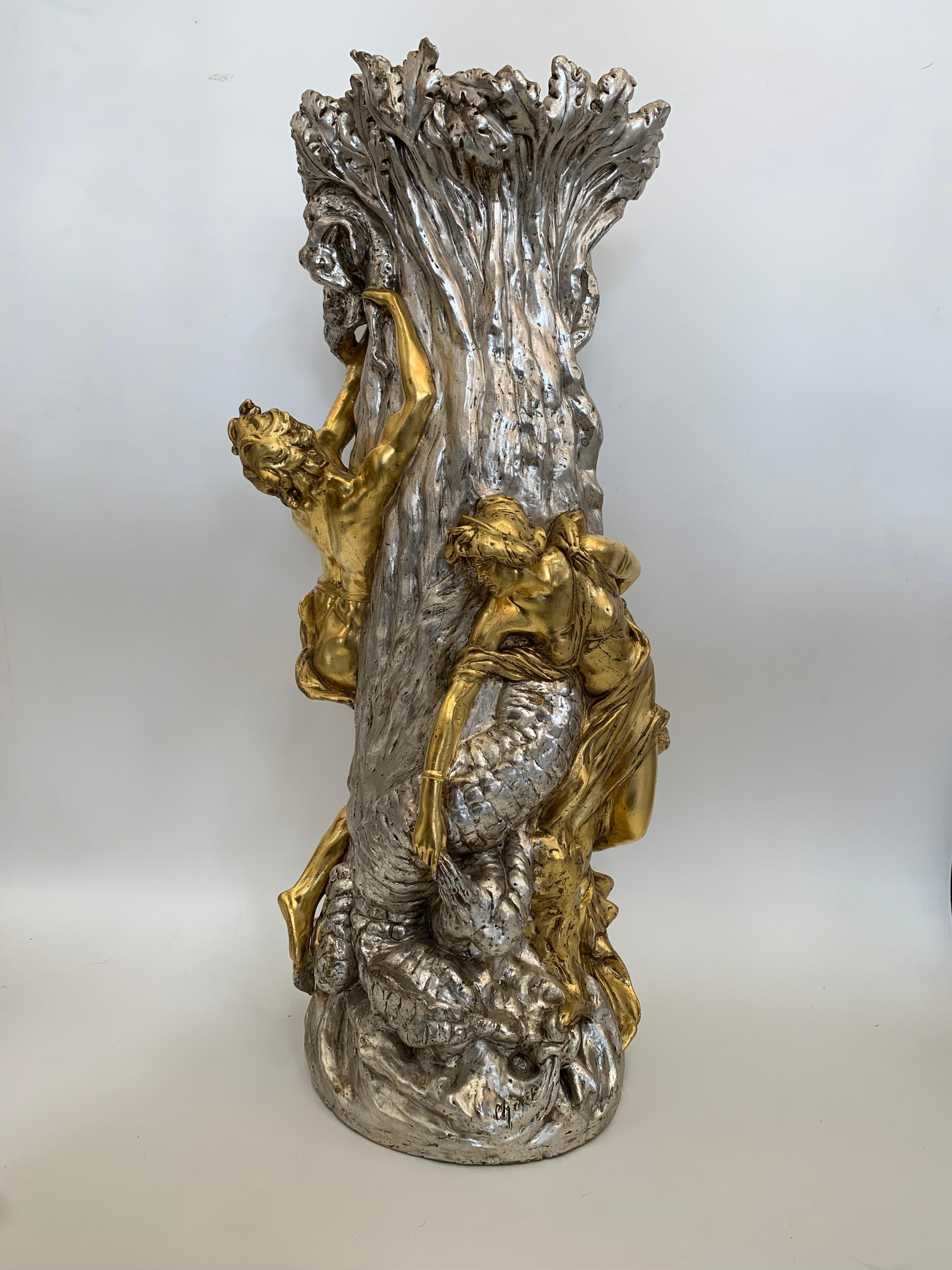 Piece unique of large size with mythological motif, terracotta with gold and silver leaf finish.